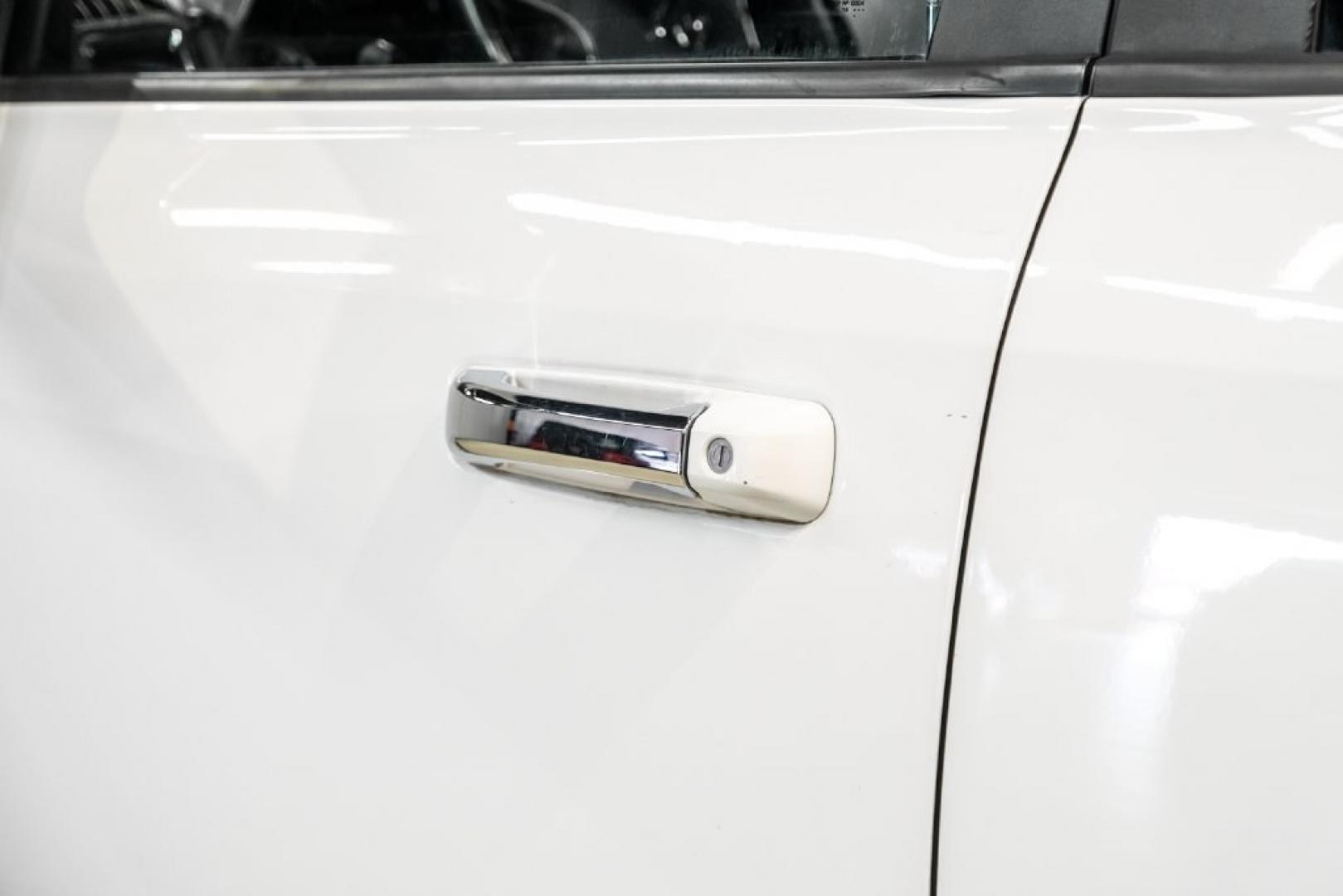 2018 Bright White Clearcoat /Black Ram 1500 Laramie (1C6RR7NM3JS) with an EcoDiesel 3.0L V6 engine, Automatic transmission, located at 15300 Midway Rd., Addison, TX, 75001, (972) 702-0011, 32.958321, -96.838074- Photo#34
