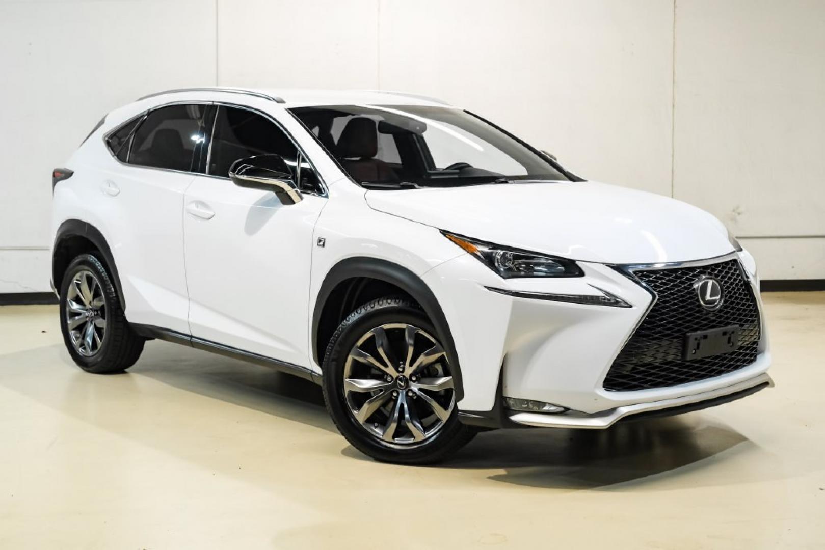 2017 Ultra White /F Sport Rioja Red Lexus NX 200t F Sport (JTJYARBZ1H2) with an 2.0L 16V DOHC engine, Automatic transmission, located at 15300 Midway Rd., Addison, TX, 75001, (972) 702-0011, 32.958321, -96.838074 - HOME OF THE NO HAGGLE PRICE - WHOLESALE PRICES TO THE PUBLIC!! 200t F Sport, 4D Sport Utility, 2.0L 16V DOHC, 6-Speed Automatic, FWD, Ultra White, F Sport Rioja Red Premium Synthetic. Odometer is 39824 miles below market average!<br><br>Ultra White 2017 Lexus NX 200t F Sport<br><br>Recent Arrival! 2- Photo#5