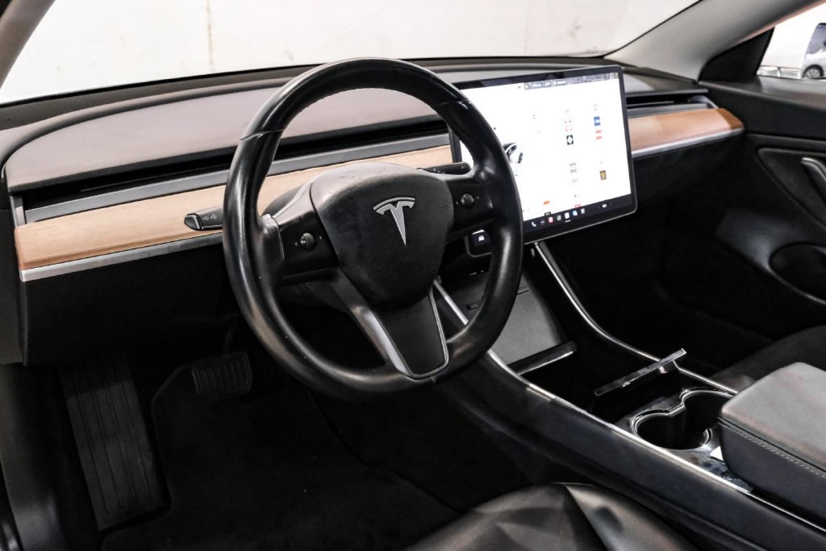 2018 Pearl White Multi-Coat /Black Tesla Model 3 Long Range (5YJ3E1EAXJF) with an Electric Motor engine, Automatic transmission, located at 15300 Midway Rd., Addison, TX, 75001, (972) 702-0011, 32.958321, -96.838074- Photo#2