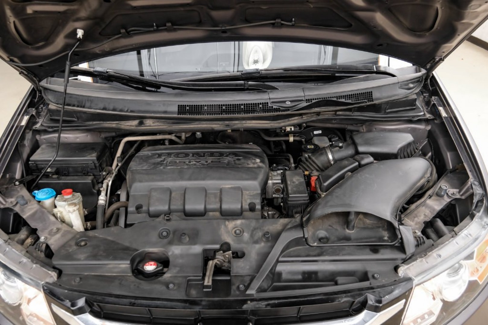 2015 Modern Steel Metallic /Beige Honda Odyssey EX-L (5FNRL5H62FB) with an 3.5L V6 SOHC i-VTEC 24V engine, Automatic transmission, located at 15300 Midway Rd., Addison, TX, 75001, (972) 702-0011, 32.958321, -96.838074- Photo#56
