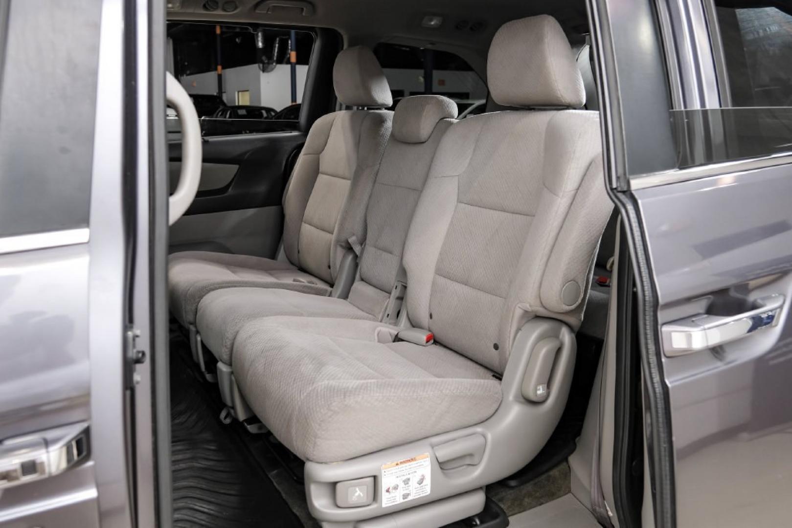 2016 Modern Steel Metallic /Beige Honda Odyssey SE (5FNRL5H35GB) with an 3.5L V6 SOHC i-VTEC 24V engine, Automatic transmission, located at 15300 Midway Rd., Addison, TX, 75001, (972) 702-0011, 32.958321, -96.838074- Photo#46