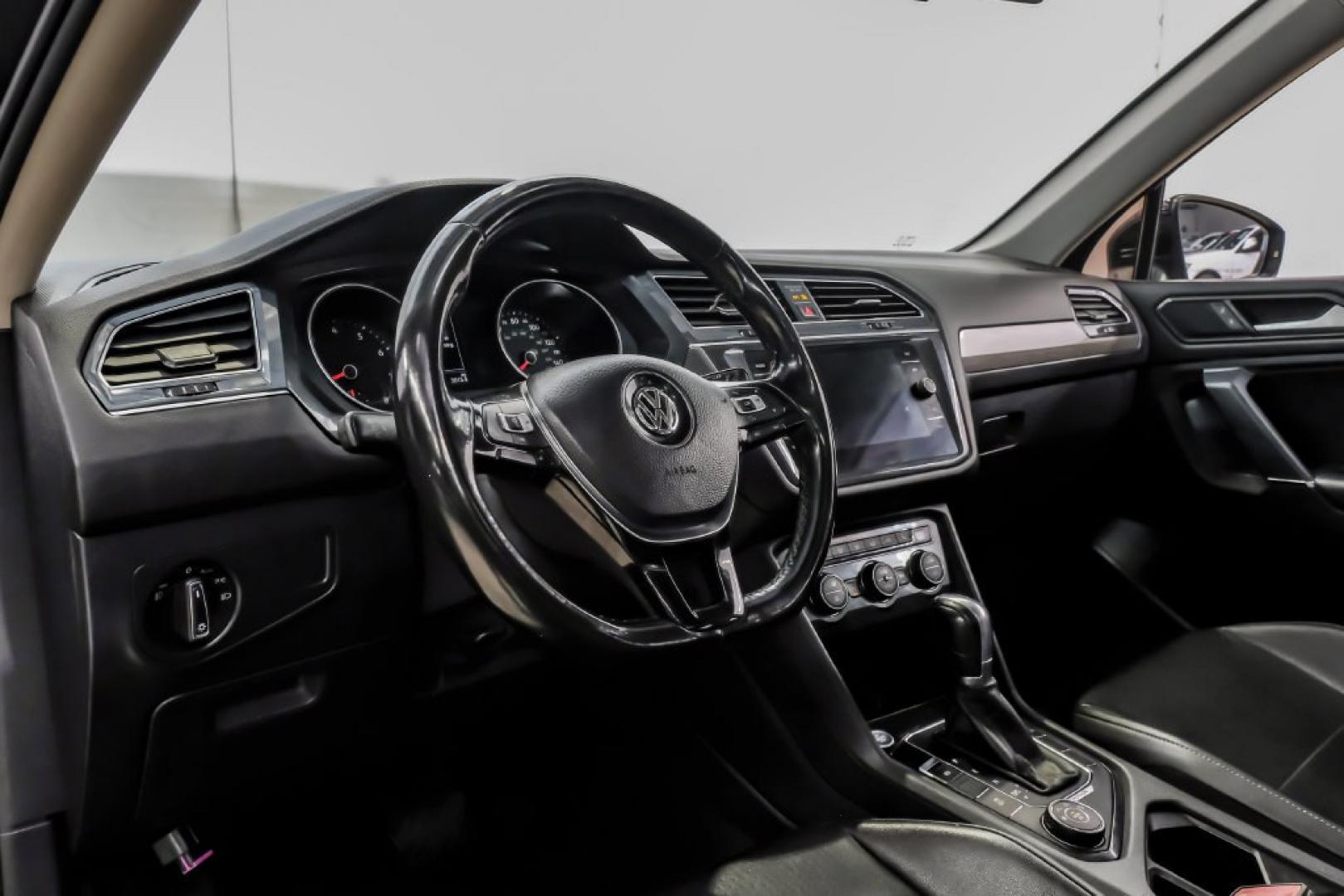 2018 Pearl Metallic /Titan Black Volkswagen Tiguan 2.0T SEL (3VV2B7AX1JM) with an 2.0L TSI DOHC engine, Automatic transmission, located at 15300 Midway Rd., Addison, TX, 75001, (972) 702-0011, 32.958321, -96.838074- Photo#2