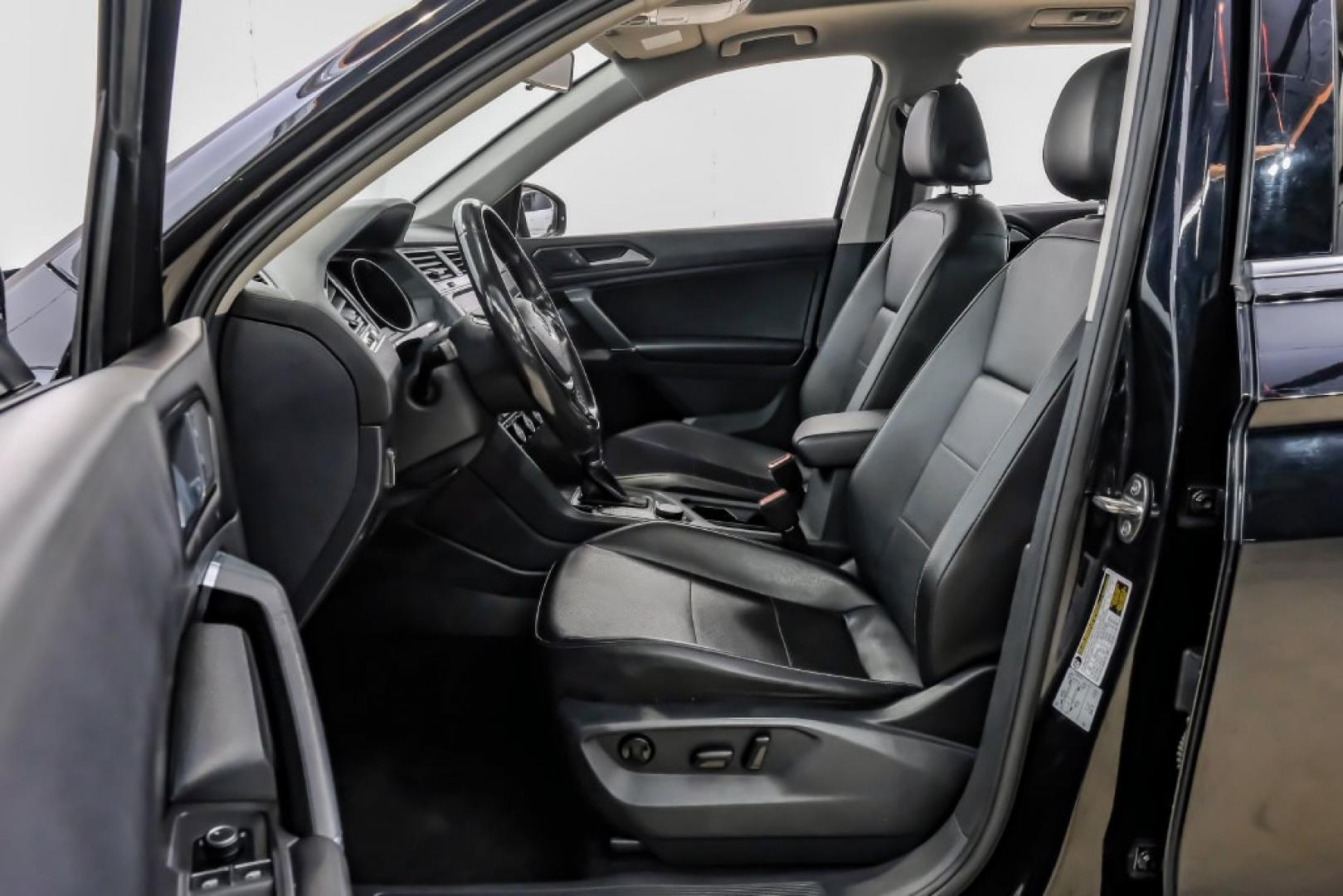 2018 Pearl Metallic /Titan Black Volkswagen Tiguan 2.0T SEL (3VV2B7AX1JM) with an 2.0L TSI DOHC engine, Automatic transmission, located at 15300 Midway Rd., Addison, TX, 75001, (972) 702-0011, 32.958321, -96.838074- Photo#3