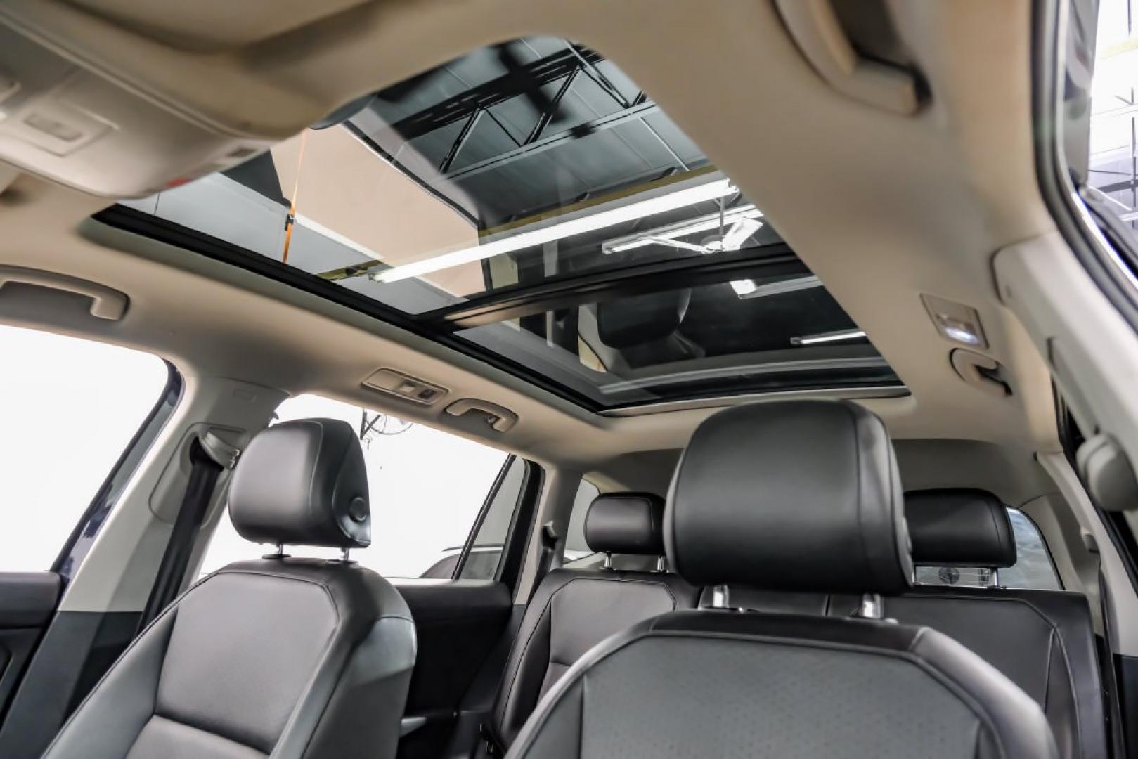 2018 Pearl Metallic /Titan Black Volkswagen Tiguan 2.0T SEL (3VV2B7AX1JM) with an 2.0L TSI DOHC engine, Automatic transmission, located at 15300 Midway Rd., Addison, TX, 75001, (972) 702-0011, 32.958321, -96.838074- Photo#4