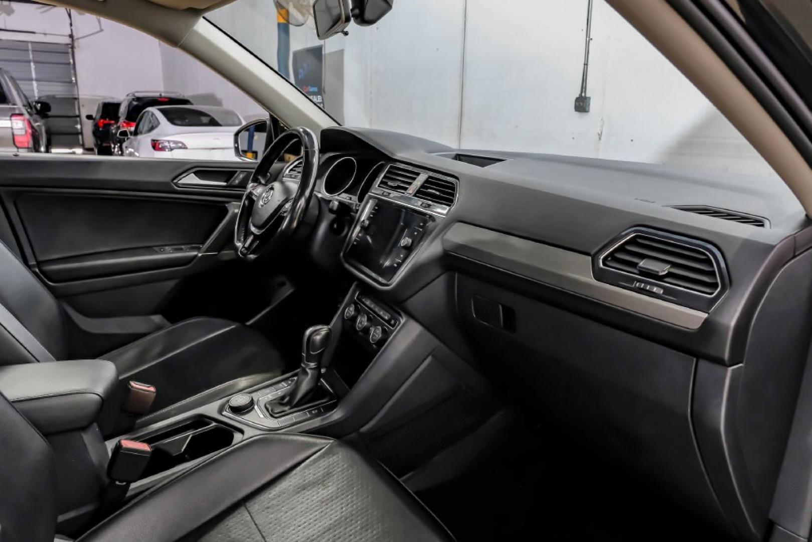 2018 Pearl Metallic /Titan Black Volkswagen Tiguan 2.0T SEL (3VV2B7AX1JM) with an 2.0L TSI DOHC engine, Automatic transmission, located at 15300 Midway Rd., Addison, TX, 75001, (972) 702-0011, 32.958321, -96.838074- Photo#18