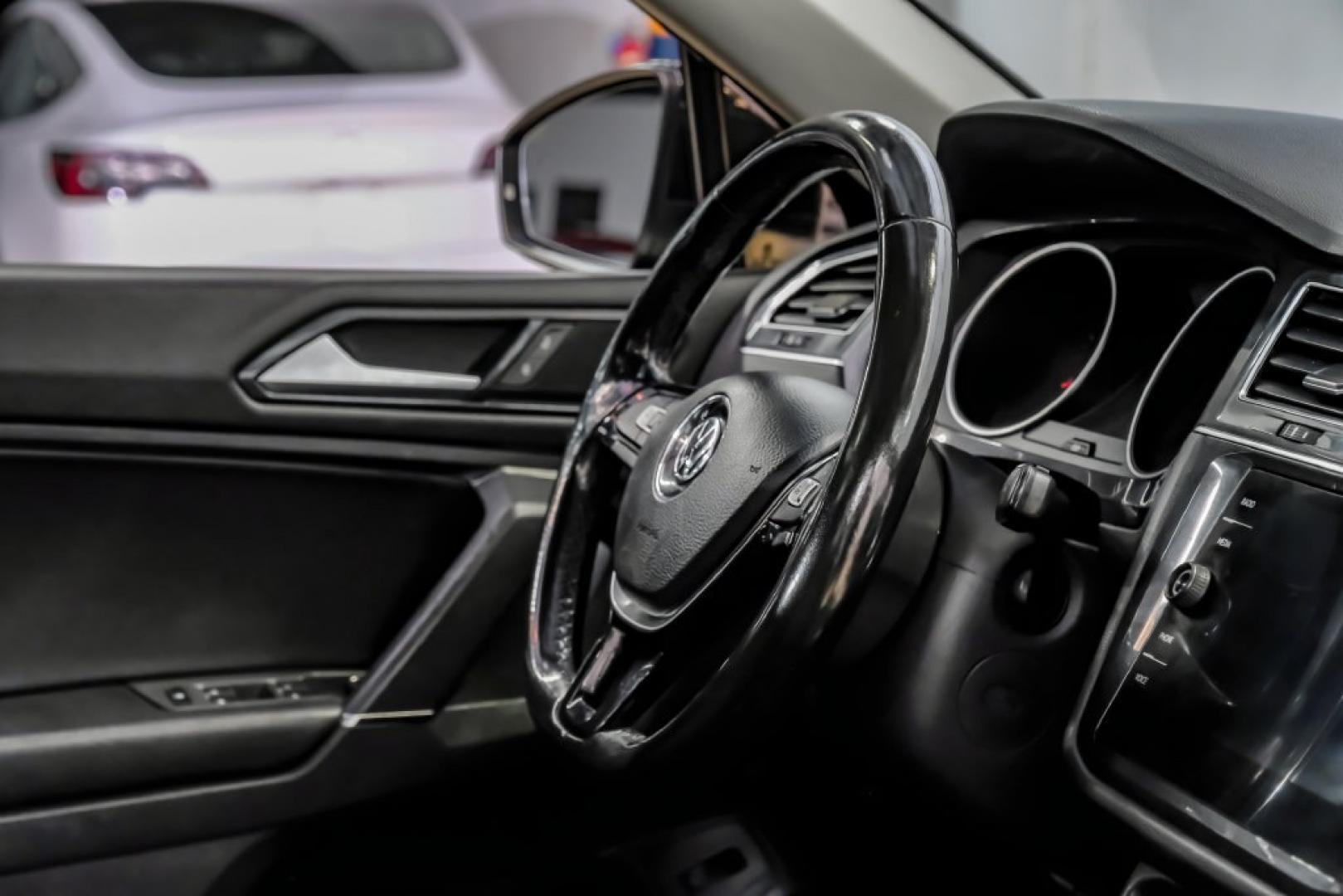 2018 Pearl Metallic /Titan Black Volkswagen Tiguan 2.0T SEL (3VV2B7AX1JM) with an 2.0L TSI DOHC engine, Automatic transmission, located at 15300 Midway Rd., Addison, TX, 75001, (972) 702-0011, 32.958321, -96.838074- Photo#20