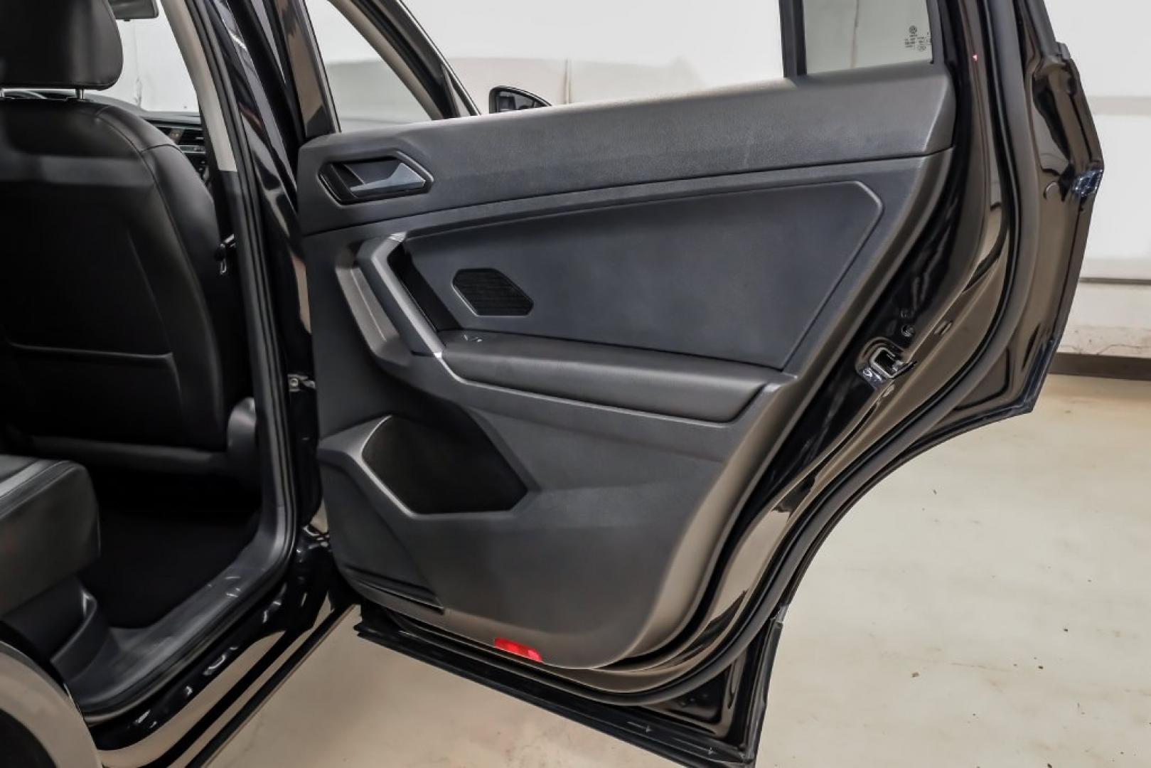 2018 Pearl Metallic /Titan Black Volkswagen Tiguan 2.0T SEL (3VV2B7AX1JM) with an 2.0L TSI DOHC engine, Automatic transmission, located at 15300 Midway Rd., Addison, TX, 75001, (972) 702-0011, 32.958321, -96.838074- Photo#56