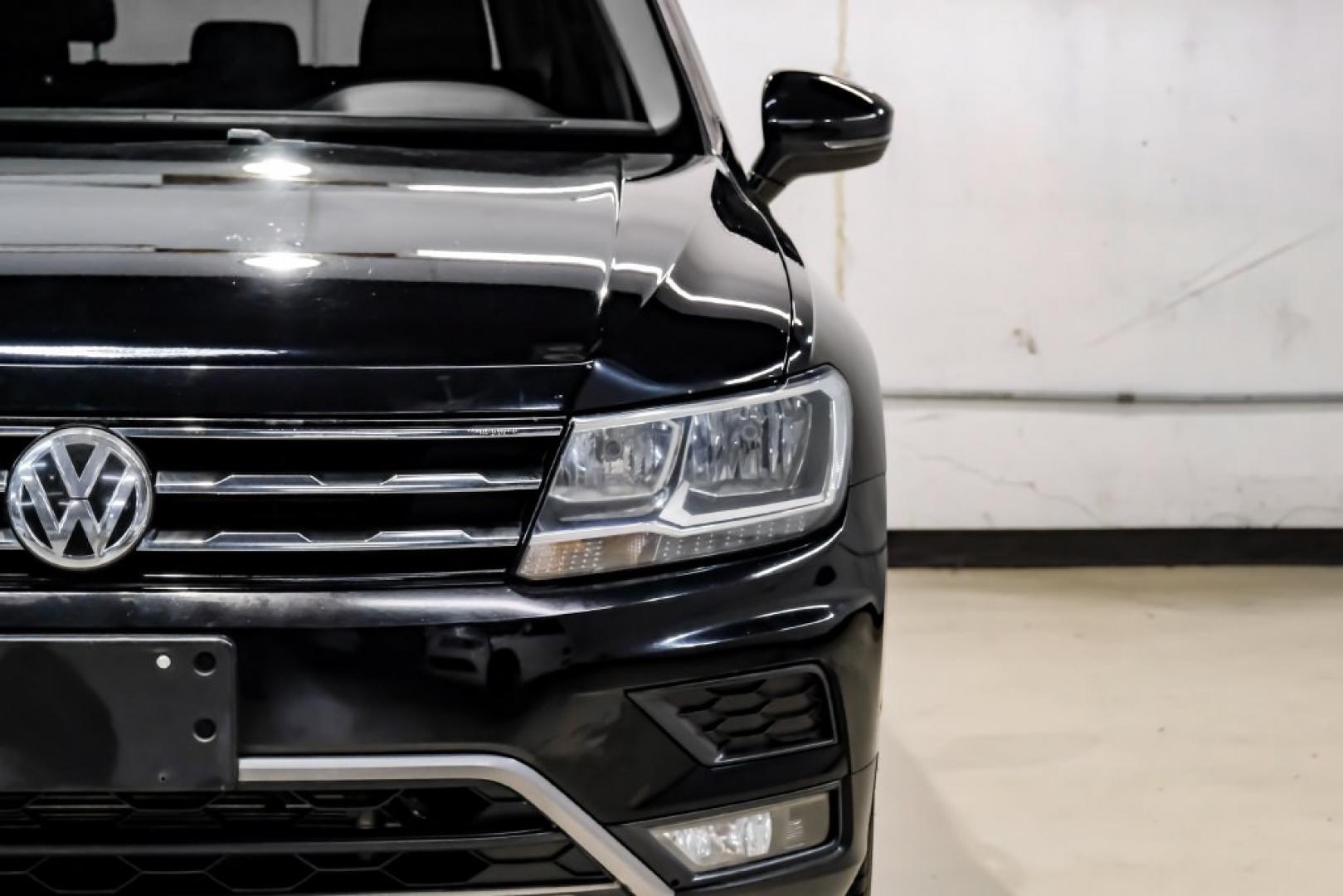 2018 Pearl Metallic /Titan Black Volkswagen Tiguan 2.0T SEL (3VV2B7AX1JM) with an 2.0L TSI DOHC engine, Automatic transmission, located at 15300 Midway Rd., Addison, TX, 75001, (972) 702-0011, 32.958321, -96.838074- Photo#57