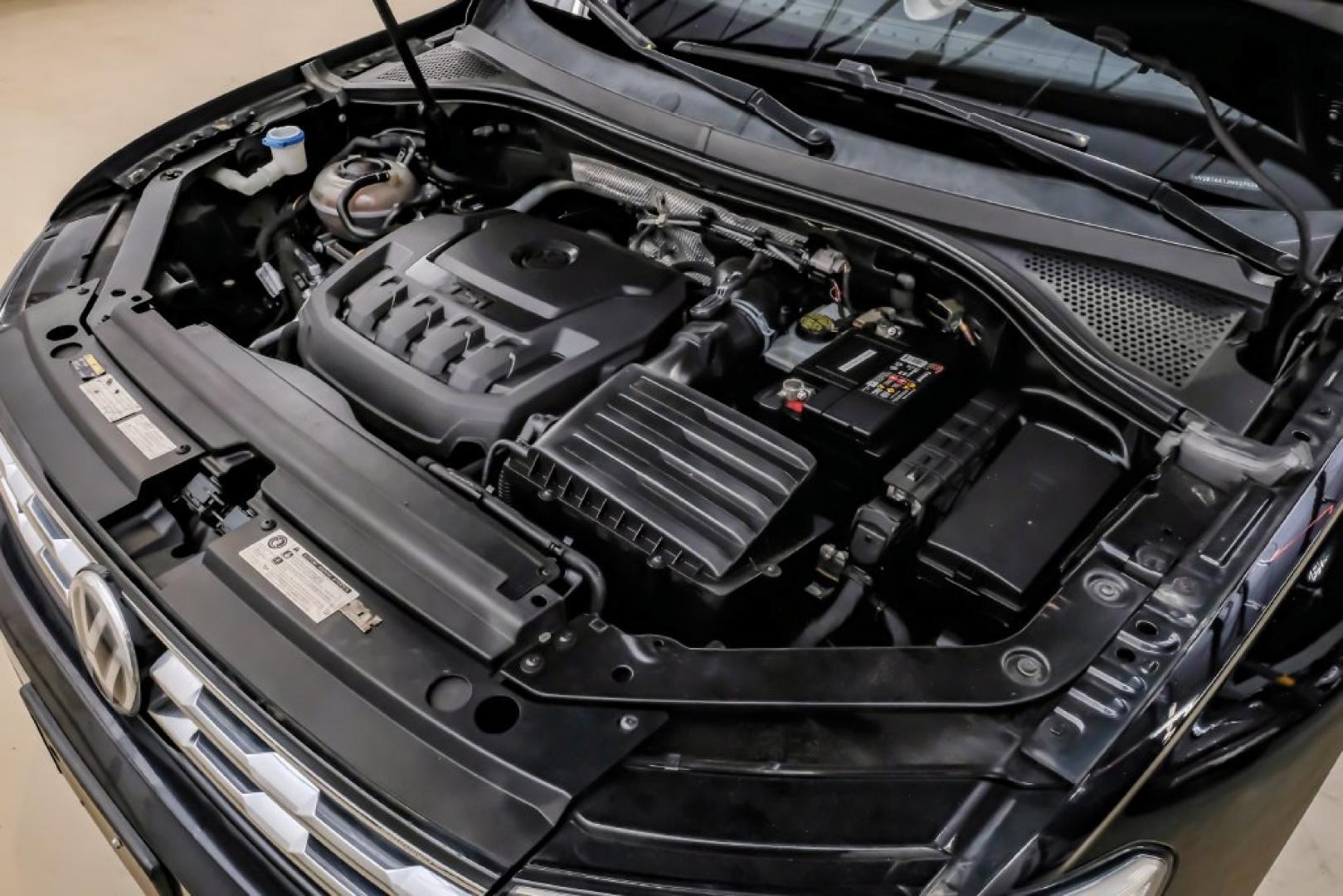 2018 Pearl Metallic /Titan Black Volkswagen Tiguan 2.0T SEL (3VV2B7AX1JM) with an 2.0L TSI DOHC engine, Automatic transmission, located at 15300 Midway Rd., Addison, TX, 75001, (972) 702-0011, 32.958321, -96.838074- Photo#61