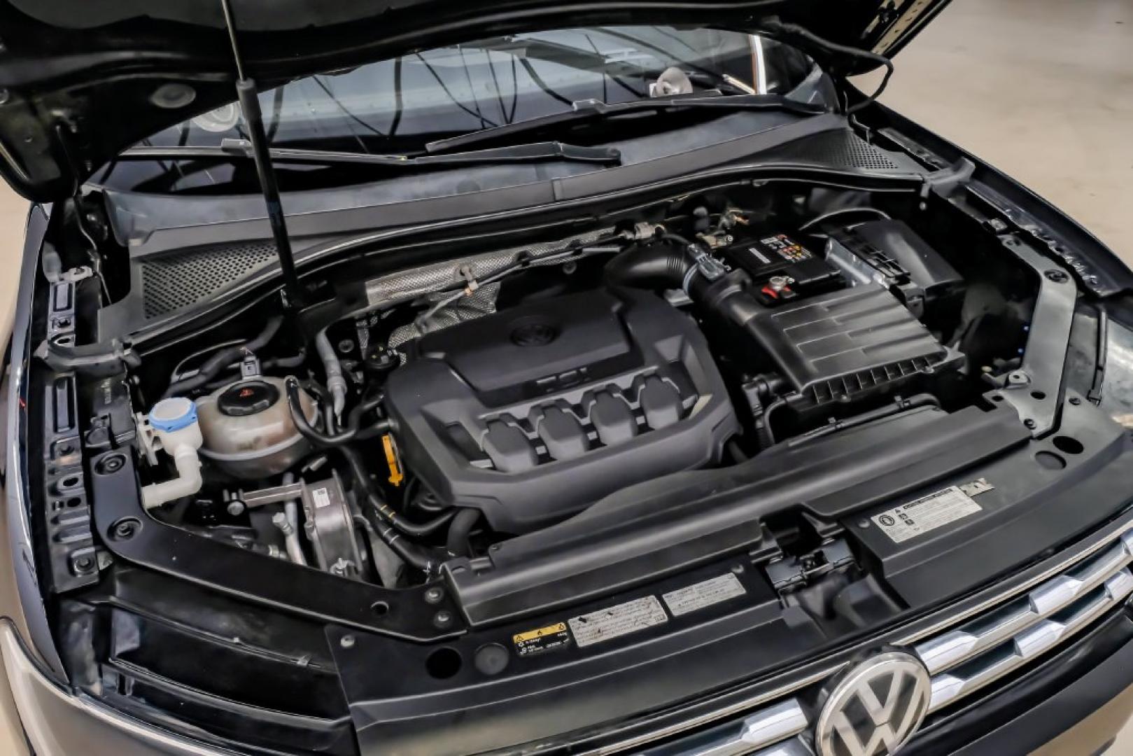 2018 Pearl Metallic /Titan Black Volkswagen Tiguan 2.0T SEL (3VV2B7AX1JM) with an 2.0L TSI DOHC engine, Automatic transmission, located at 15300 Midway Rd., Addison, TX, 75001, (972) 702-0011, 32.958321, -96.838074- Photo#63