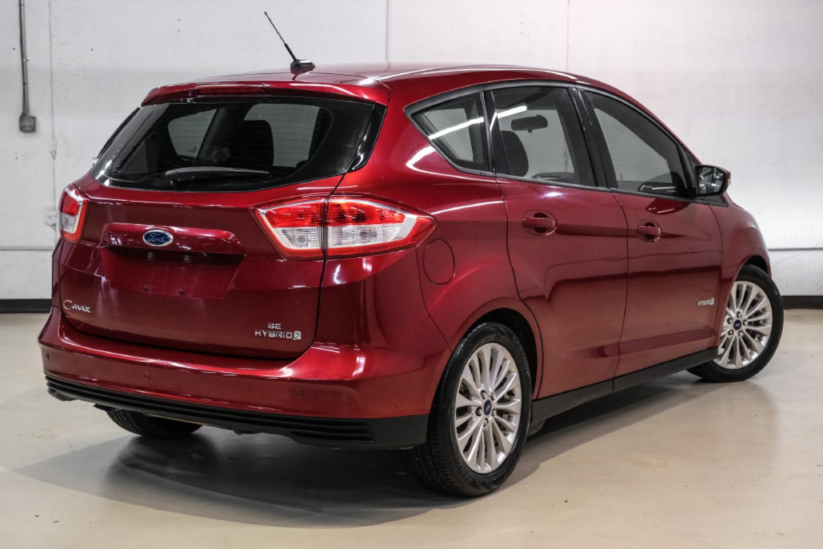 2017 Ruby Red Metallic /Black Ford C-Max Hybrid SE (1FADP5AU1HL) with an I4 Hybrid engine, CVT transmission, located at 15300 Midway Rd., Addison, TX, 75001, (972) 702-0011, 32.958321, -96.838074- Photo#7