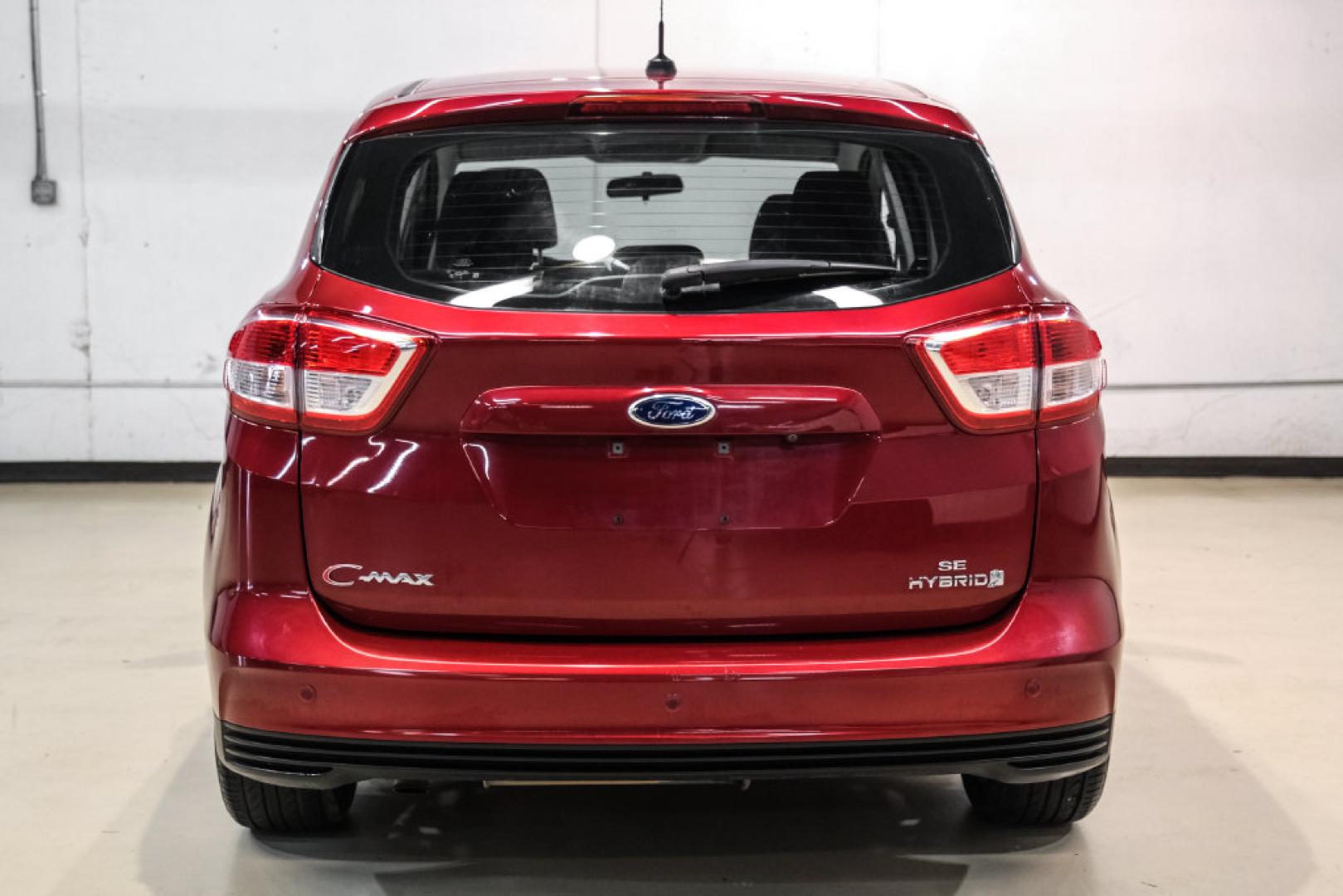 2017 Ruby Red Metallic /Black Ford C-Max Hybrid SE (1FADP5AU1HL) with an I4 Hybrid engine, CVT transmission, located at 15300 Midway Rd., Addison, TX, 75001, (972) 702-0011, 32.958321, -96.838074- Photo#8