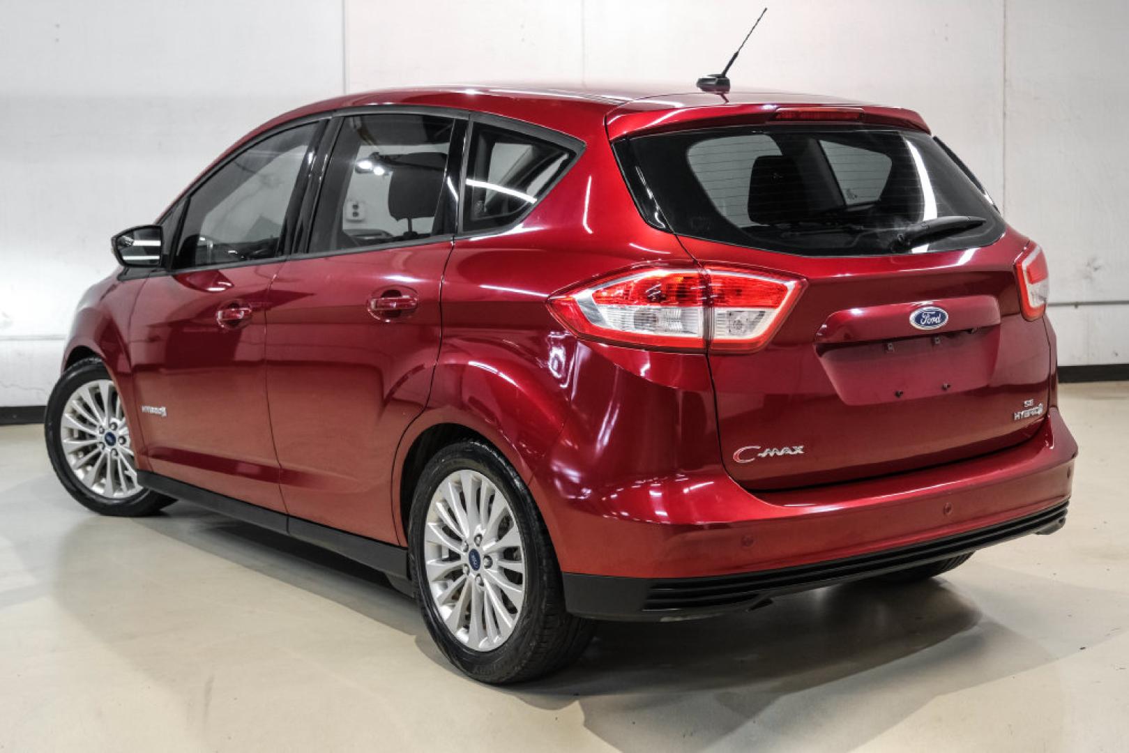 2017 Ruby Red Metallic /Black Ford C-Max Hybrid SE (1FADP5AU1HL) with an I4 Hybrid engine, CVT transmission, located at 15300 Midway Rd., Addison, TX, 75001, (972) 702-0011, 32.958321, -96.838074- Photo#9