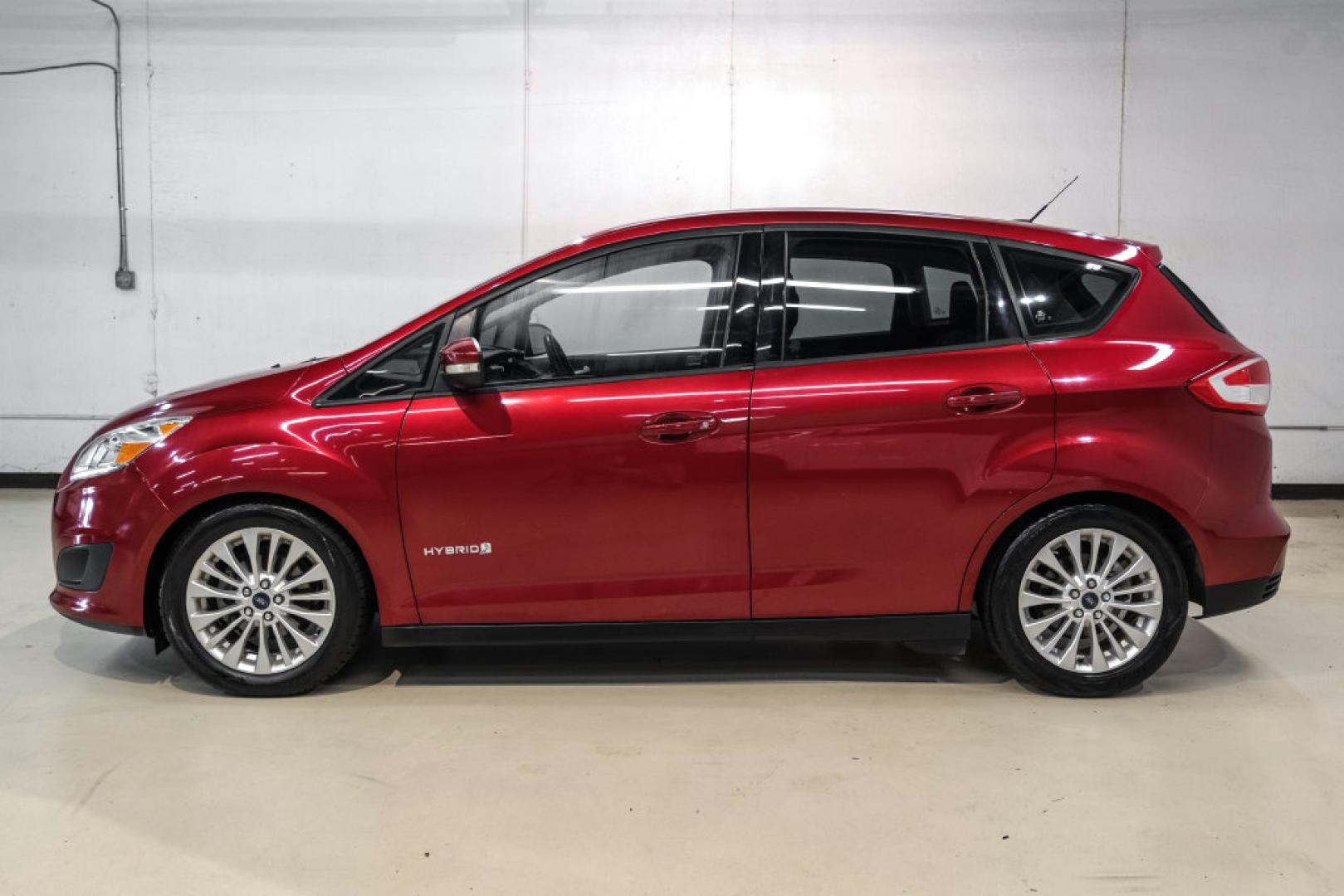 2017 Ruby Red Metallic /Black Ford C-Max Hybrid SE (1FADP5AU1HL) with an I4 Hybrid engine, CVT transmission, located at 15300 Midway Rd., Addison, TX, 75001, (972) 702-0011, 32.958321, -96.838074- Photo#10
