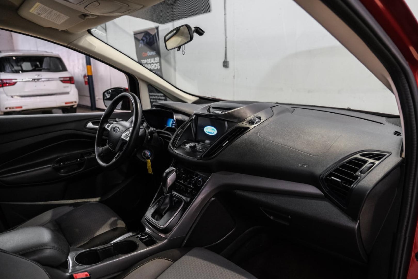 2017 Ruby Red Metallic /Black Ford C-Max Hybrid SE (1FADP5AU1HL) with an I4 Hybrid engine, CVT transmission, located at 15300 Midway Rd., Addison, TX, 75001, (972) 702-0011, 32.958321, -96.838074- Photo#11