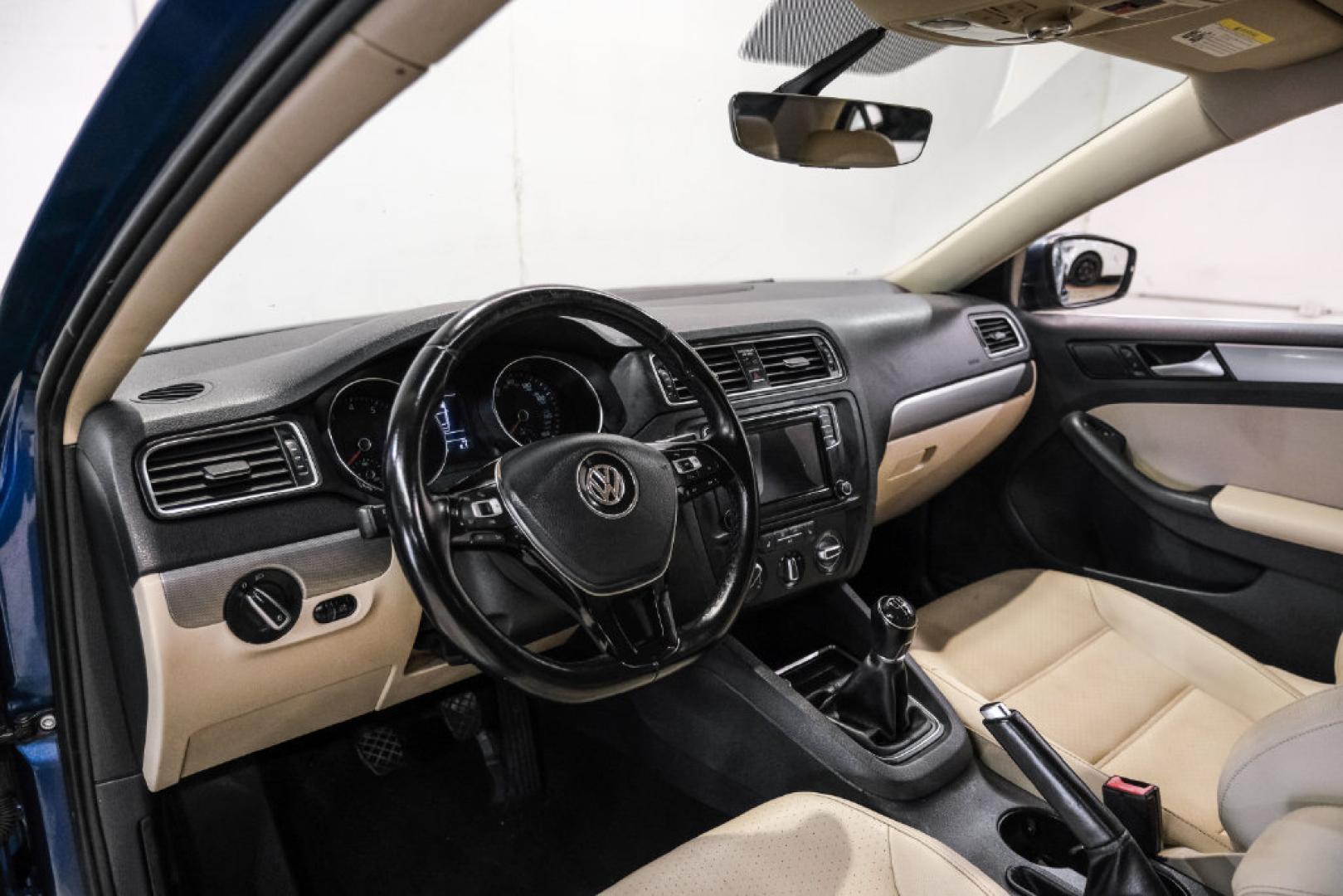 2017 Blue Metallic /Cornsilk Beige Volkswagen Jetta 1.4T SE (3VWB67AJ6HM) with an 1.4L TSI engine, Manual transmission, located at 15300 Midway Rd., Addison, TX, 75001, (972) 702-0011, 32.958321, -96.838074- Photo#2