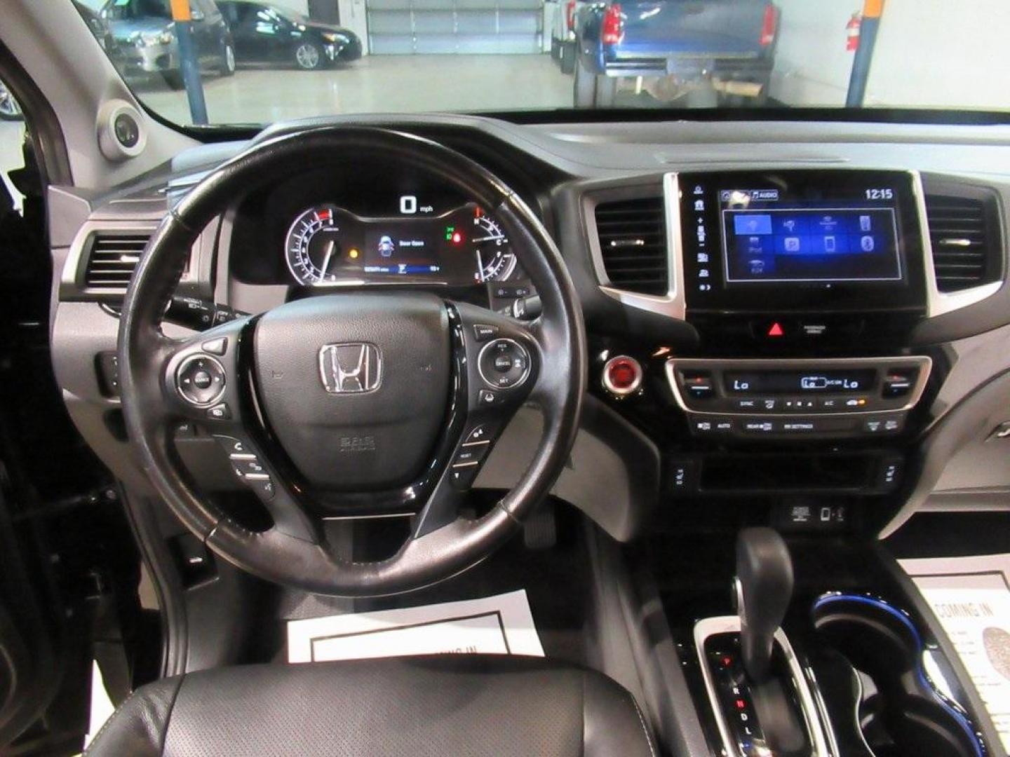 2019 Crystal Black Pearl /Black Honda Ridgeline RTL-E (5FPYK3F75KB) with an 3.5L V6 SOHC i-VTEC 24V engine, Automatic transmission, located at 15300 Midway Rd., Addison, TX, 75001, (972) 702-0011, 32.958321, -96.838074 - HOME OF THE NO HAGGLE PRICE - WHOLESALE PRICES TO THE PUBLIC!! 4WD, Bluetooth, Hands Free Connectivity, Navigation, Premium Audio, Backup Camera, Leather Seats, Sunroof / Moonroof, Ridgeline RTL-E, 4D Crew Cab, 3.5L V6 SOHC i-VTEC 24V, 6-Speed Automatic, AWD, Black, Black Leather.<br><br>Black 2019 - Photo#14