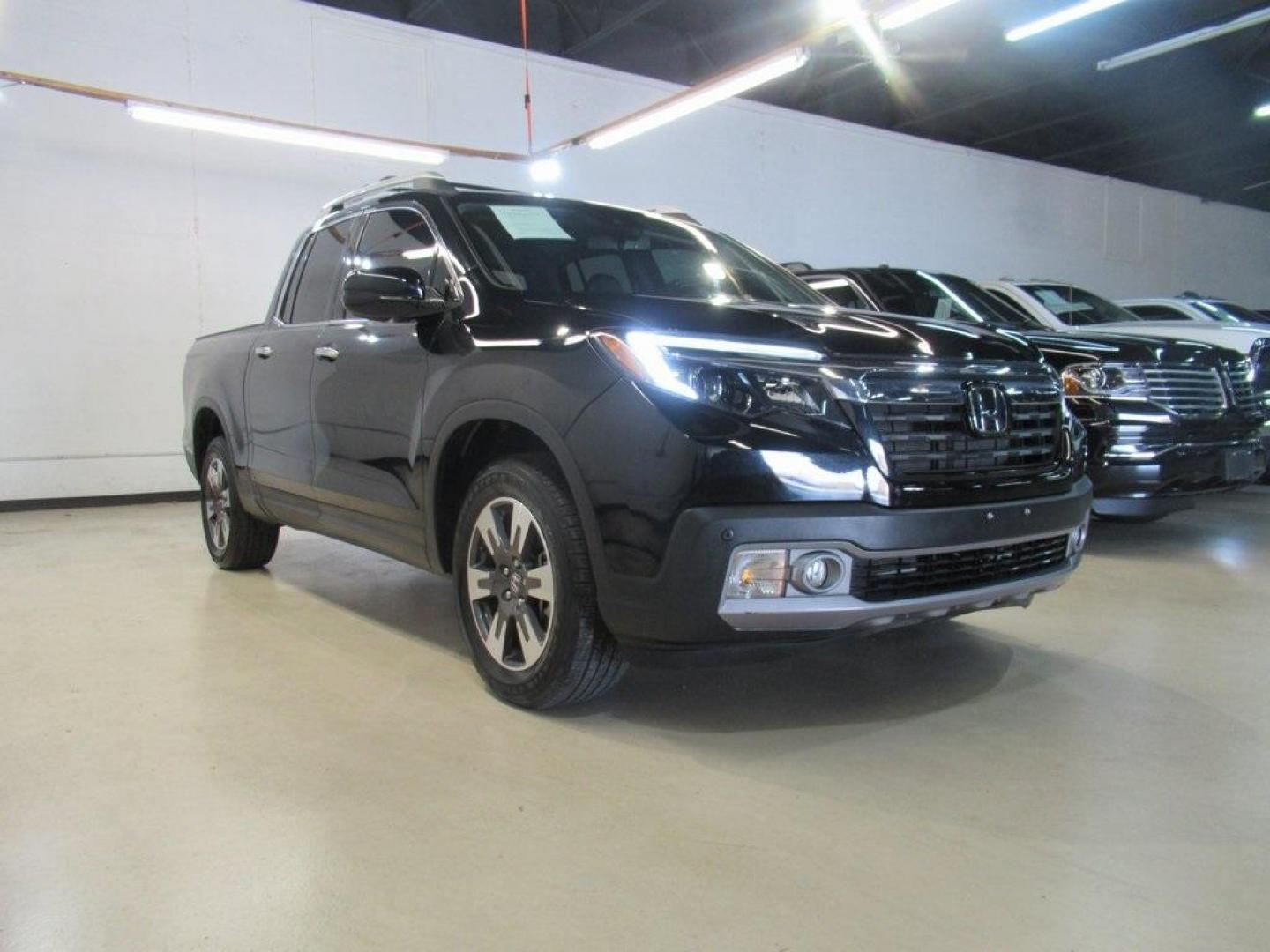 2019 Crystal Black Pearl /Black Honda Ridgeline RTL-E (5FPYK3F75KB) with an 3.5L V6 SOHC i-VTEC 24V engine, Automatic transmission, located at 15300 Midway Rd., Addison, TX, 75001, (972) 702-0011, 32.958321, -96.838074 - HOME OF THE NO HAGGLE PRICE - WHOLESALE PRICES TO THE PUBLIC!! 4WD, Bluetooth, Hands Free Connectivity, Navigation, Premium Audio, Backup Camera, Leather Seats, Sunroof / Moonroof, Ridgeline RTL-E, 4D Crew Cab, 3.5L V6 SOHC i-VTEC 24V, 6-Speed Automatic, AWD, Black, Black Leather.<br><br>Black 2019 - Photo#1
