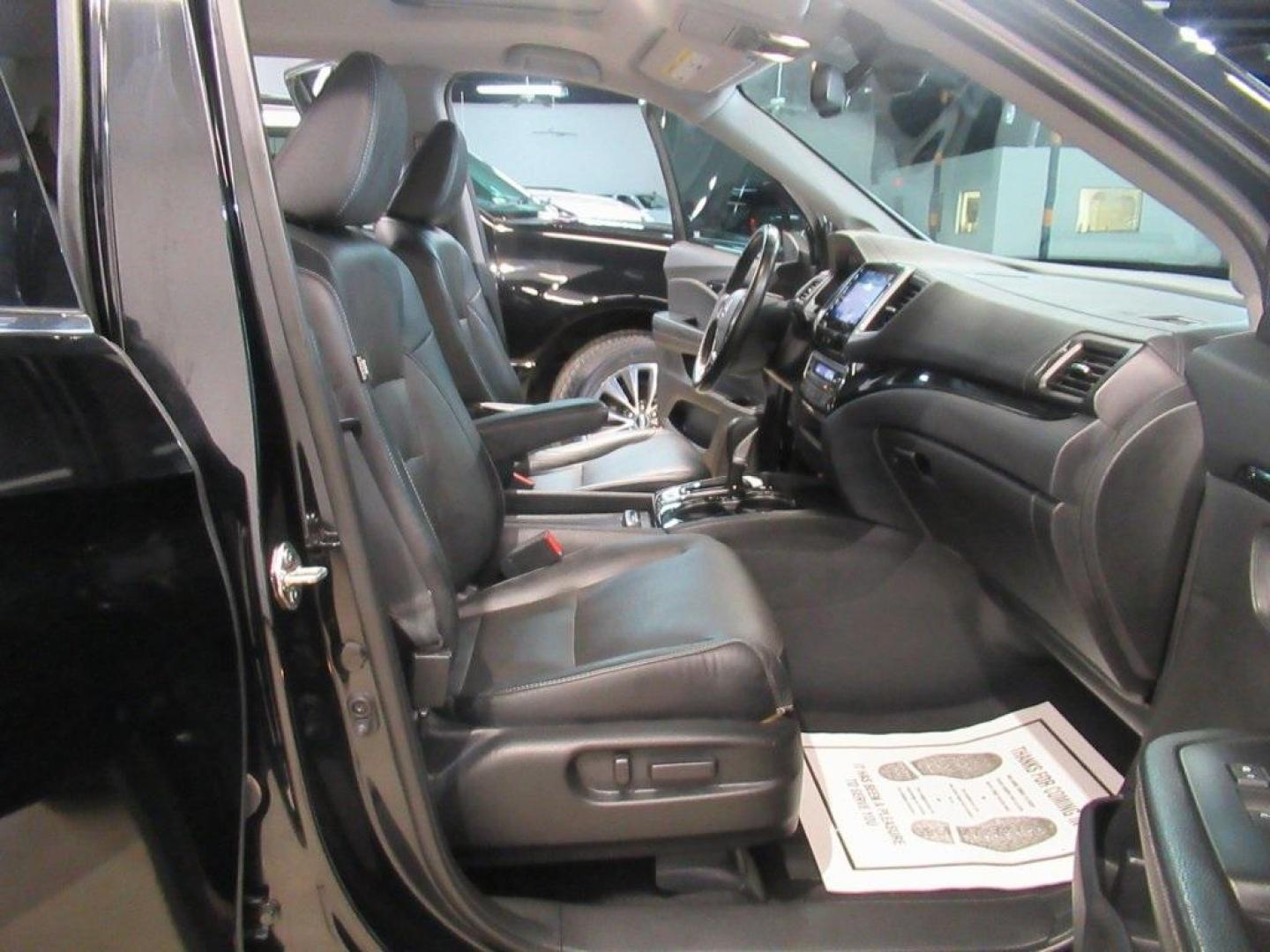 2019 Crystal Black Pearl /Black Honda Ridgeline RTL-E (5FPYK3F75KB) with an 3.5L V6 SOHC i-VTEC 24V engine, Automatic transmission, located at 15300 Midway Rd., Addison, TX, 75001, (972) 702-0011, 32.958321, -96.838074 - HOME OF THE NO HAGGLE PRICE - WHOLESALE PRICES TO THE PUBLIC!! 4WD, Bluetooth, Hands Free Connectivity, Navigation, Premium Audio, Backup Camera, Leather Seats, Sunroof / Moonroof, Ridgeline RTL-E, 4D Crew Cab, 3.5L V6 SOHC i-VTEC 24V, 6-Speed Automatic, AWD, Black, Black Leather.<br><br>Black 2019 - Photo#26