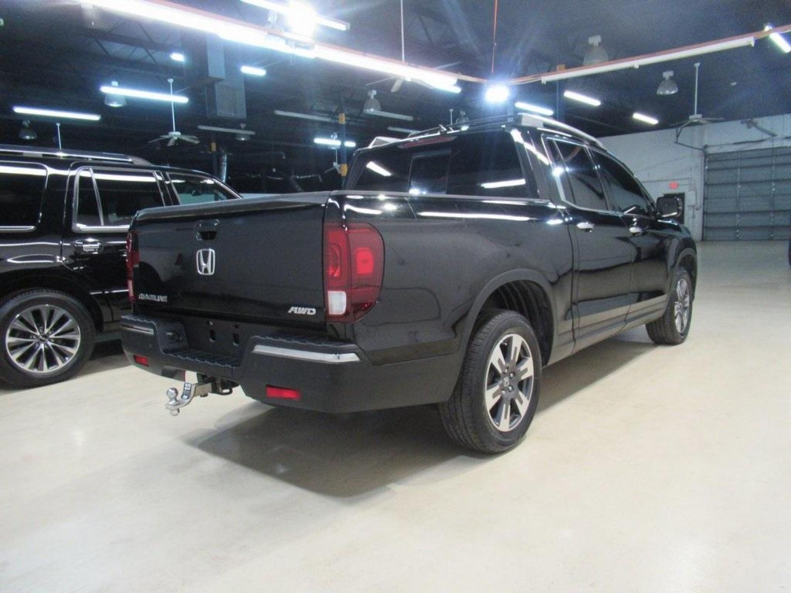 2019 Crystal Black Pearl /Black Honda Ridgeline RTL-E (5FPYK3F75KB) with an 3.5L V6 SOHC i-VTEC 24V engine, Automatic transmission, located at 15300 Midway Rd., Addison, TX, 75001, (972) 702-0011, 32.958321, -96.838074 - HOME OF THE NO HAGGLE PRICE - WHOLESALE PRICES TO THE PUBLIC!! 4WD, Bluetooth, Hands Free Connectivity, Navigation, Premium Audio, Backup Camera, Leather Seats, Sunroof / Moonroof, Ridgeline RTL-E, 4D Crew Cab, 3.5L V6 SOHC i-VTEC 24V, 6-Speed Automatic, AWD, Black, Black Leather.<br><br>Black 2019 - Photo #2
