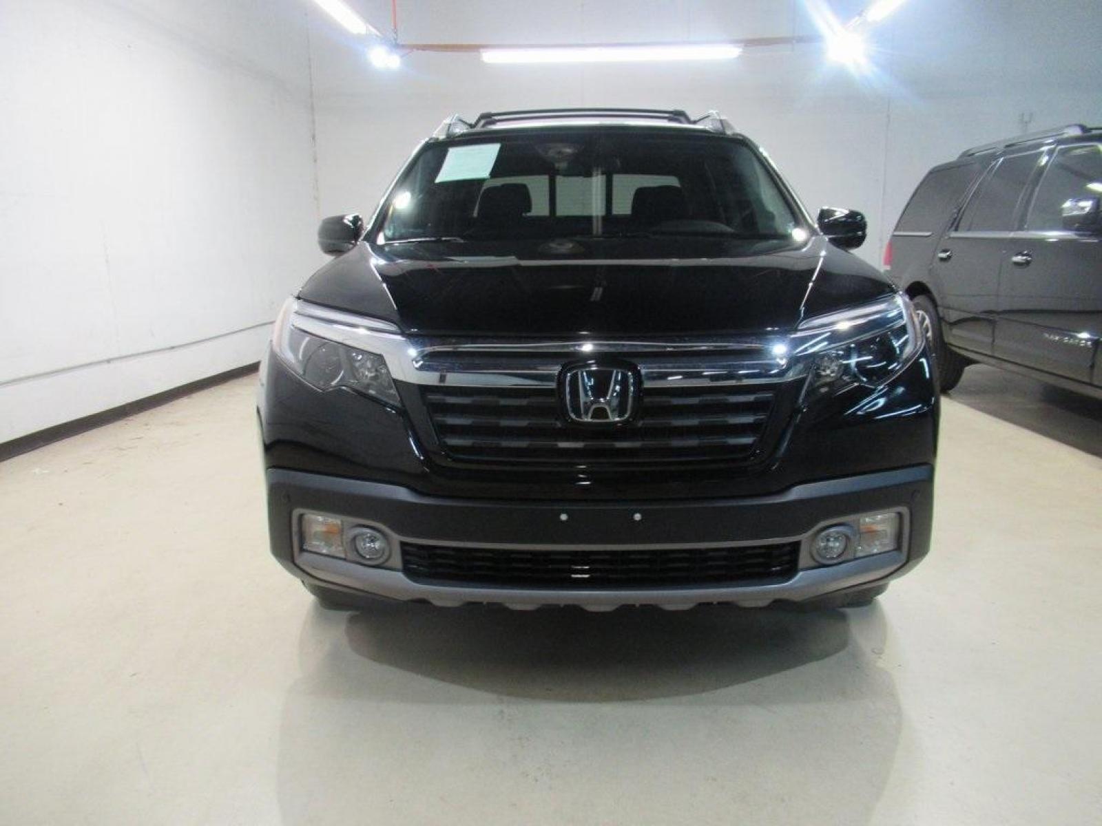 2019 Crystal Black Pearl /Black Honda Ridgeline RTL-E (5FPYK3F75KB) with an 3.5L V6 SOHC i-VTEC 24V engine, Automatic transmission, located at 15300 Midway Rd., Addison, TX, 75001, (972) 702-0011, 32.958321, -96.838074 - HOME OF THE NO HAGGLE PRICE - WHOLESALE PRICES TO THE PUBLIC!! 4WD, Bluetooth, Hands Free Connectivity, Navigation, Premium Audio, Backup Camera, Leather Seats, Sunroof / Moonroof, Ridgeline RTL-E, 4D Crew Cab, 3.5L V6 SOHC i-VTEC 24V, 6-Speed Automatic, AWD, Black, Black Leather.<br><br>Black 2019 - Photo #5