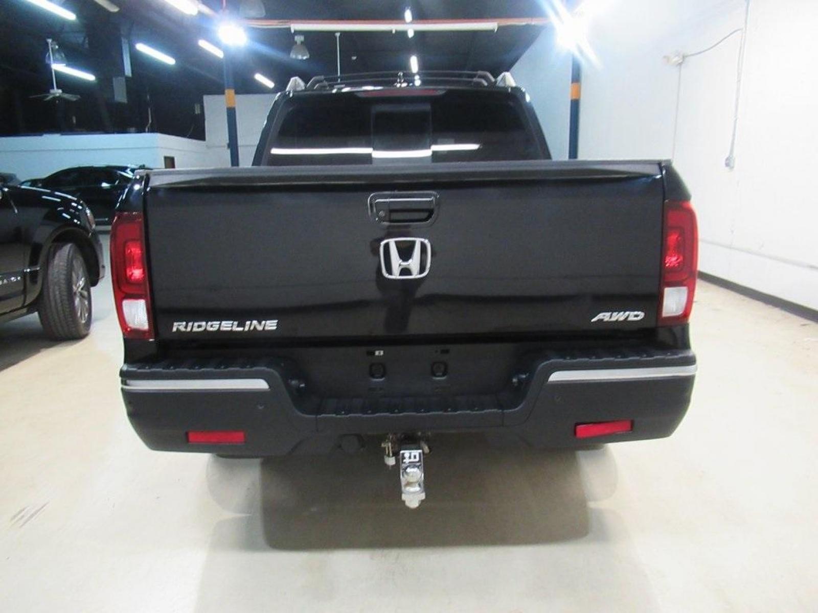 2019 Crystal Black Pearl /Black Honda Ridgeline RTL-E (5FPYK3F75KB) with an 3.5L V6 SOHC i-VTEC 24V engine, Automatic transmission, located at 15300 Midway Rd., Addison, 75001, (972) 702-0011, 32.958321, -96.838074 - HOME OF THE NO HAGGLE PRICE - WHOLESALE PRICES TO THE PUBLIC!! 4WD, Bluetooth, Hands Free Connectivity, Navigation, Premium Audio, Backup Camera, Leather Seats, Sunroof / Moonroof, Ridgeline RTL-E, 4D Crew Cab, 3.5L V6 SOHC i-VTEC 24V, 6-Speed Automatic, AWD, Black, Black Leather.<br><br>Black 2019 - Photo #7