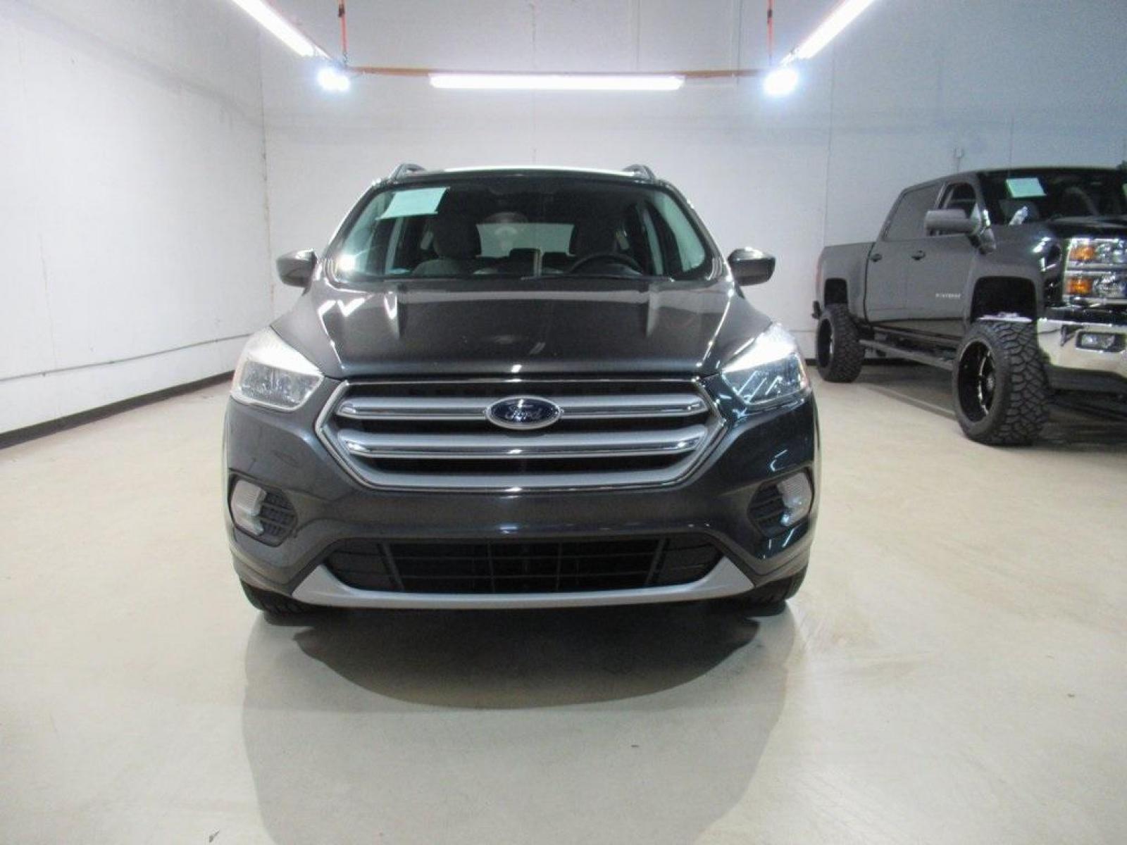 2018 Magnetic /Medium Light Stone Ford Escape SE (1FMCU0GD7JU) with an EcoBoost 1.5L I4 GTDi DOHC Turbocharged VCT engine, Automatic transmission, located at 15300 Midway Rd., Addison, 75001, (972) 702-0011, 32.958321, -96.838074 - Photo #5