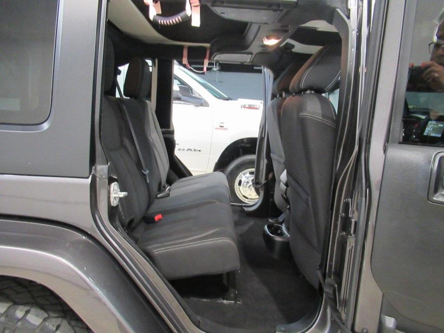2018 Granite Crystal Metallic Clearcoat /Black Jeep Wrangler JK Unlimited Sahara (1C4BJWEG0JL) with an 3.6L V6 24V VVT engine, Automatic transmission, located at 15300 Midway Rd., Addison, TX, 75001, (972) 702-0011, 32.958321, -96.838074 - HOME OF THE NO HAGGLE PRICE - WHOLESALE PRICES TO THE PUBLIC!! Wrangler JK Unlimited Sahara, 4D Sport Utility, 3.6L V6 24V VVT, 5-Speed Automatic, 4WD, Granite Crystal Metallic Clearcoat, Black Cloth.<br><br>Granite Crystal Metallic Clearcoat 2018 Jeep Wrangler JK Unlimited Sahara<br><br>Recent Arri - Photo#14