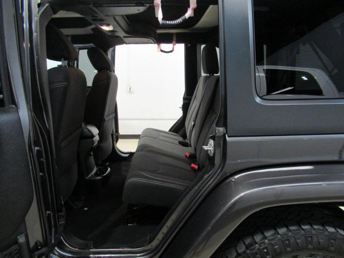 2018 Granite Crystal Metallic Clearcoat /Black Jeep Wrangler JK Unlimited Sahara (1C4BJWEG0JL) with an 3.6L V6 24V VVT engine, Automatic transmission, located at 15300 Midway Rd., Addison, TX, 75001, (972) 702-0011, 32.958321, -96.838074 - HOME OF THE NO HAGGLE PRICE - WHOLESALE PRICES TO THE PUBLIC!! Wrangler JK Unlimited Sahara, 4D Sport Utility, 3.6L V6 24V VVT, 5-Speed Automatic, 4WD, Granite Crystal Metallic Clearcoat, Black Cloth.<br><br>Granite Crystal Metallic Clearcoat 2018 Jeep Wrangler JK Unlimited Sahara<br><br>Recent Arri - Photo#15