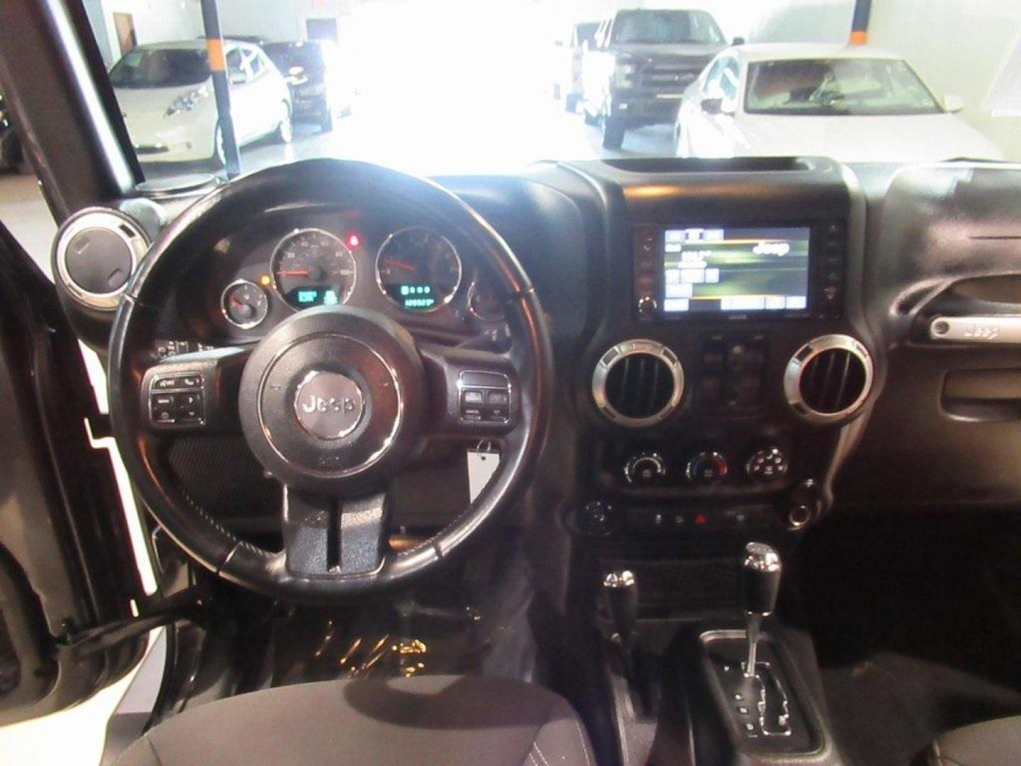 2018 Granite Crystal Metallic Clearcoat /Black Jeep Wrangler JK Unlimited Sahara (1C4BJWEG0JL) with an 3.6L V6 24V VVT engine, Automatic transmission, located at 15300 Midway Rd., Addison, TX, 75001, (972) 702-0011, 32.958321, -96.838074 - HOME OF THE NO HAGGLE PRICE - WHOLESALE PRICES TO THE PUBLIC!! Wrangler JK Unlimited Sahara, 4D Sport Utility, 3.6L V6 24V VVT, 5-Speed Automatic, 4WD, Granite Crystal Metallic Clearcoat, Black Cloth.<br><br>Granite Crystal Metallic Clearcoat 2018 Jeep Wrangler JK Unlimited Sahara<br><br>Recent Arri - Photo#17