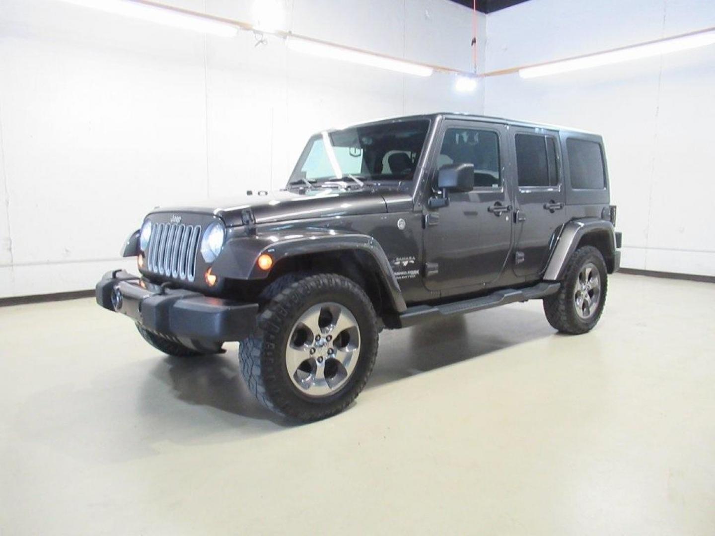 2018 Granite Crystal Metallic Clearcoat /Black Jeep Wrangler JK Unlimited Sahara (1C4BJWEG0JL) with an 3.6L V6 24V VVT engine, Automatic transmission, located at 15300 Midway Rd., Addison, TX, 75001, (972) 702-0011, 32.958321, -96.838074 - HOME OF THE NO HAGGLE PRICE - WHOLESALE PRICES TO THE PUBLIC!! Wrangler JK Unlimited Sahara, 4D Sport Utility, 3.6L V6 24V VVT, 5-Speed Automatic, 4WD, Granite Crystal Metallic Clearcoat, Black Cloth.<br><br>Granite Crystal Metallic Clearcoat 2018 Jeep Wrangler JK Unlimited Sahara<br><br>Recent Arri - Photo#3