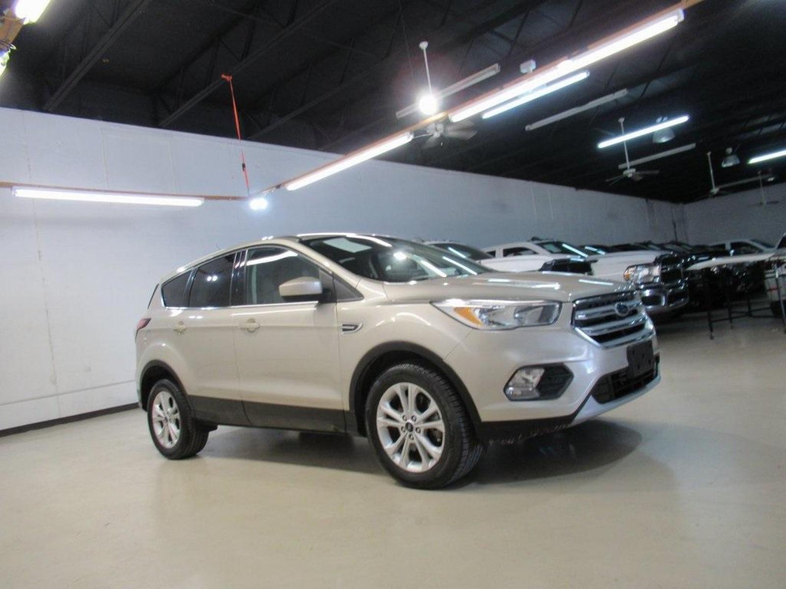 2017 White Gold Metallic /Charcoal Black Ford Escape SE (1FMCU0G94HU) with an EcoBoost 2.0L I4 GTDi DOHC Turbocharged VCT engine, Automatic transmission, located at 15300 Midway Rd., Addison, 75001, (972) 702-0011, 32.958321, -96.838074 - HOME OF THE NO HAGGLE PRICE - WHOLESALE PRICES TO THE PUBLIC!! Escape SE, 4D Sport Utility, EcoBoost 2.0L I4 GTDi DOHC Turbocharged VCT, 6-Speed Automatic, FWD, Gold, Charcoal Black Cloth.<br><br>Gold 2017 Ford Escape SE<br><br>Recent Arrival! 22/29 City/Highway MPG<br><br>Awards:<br> * 2017 KBB.co - Photo #6