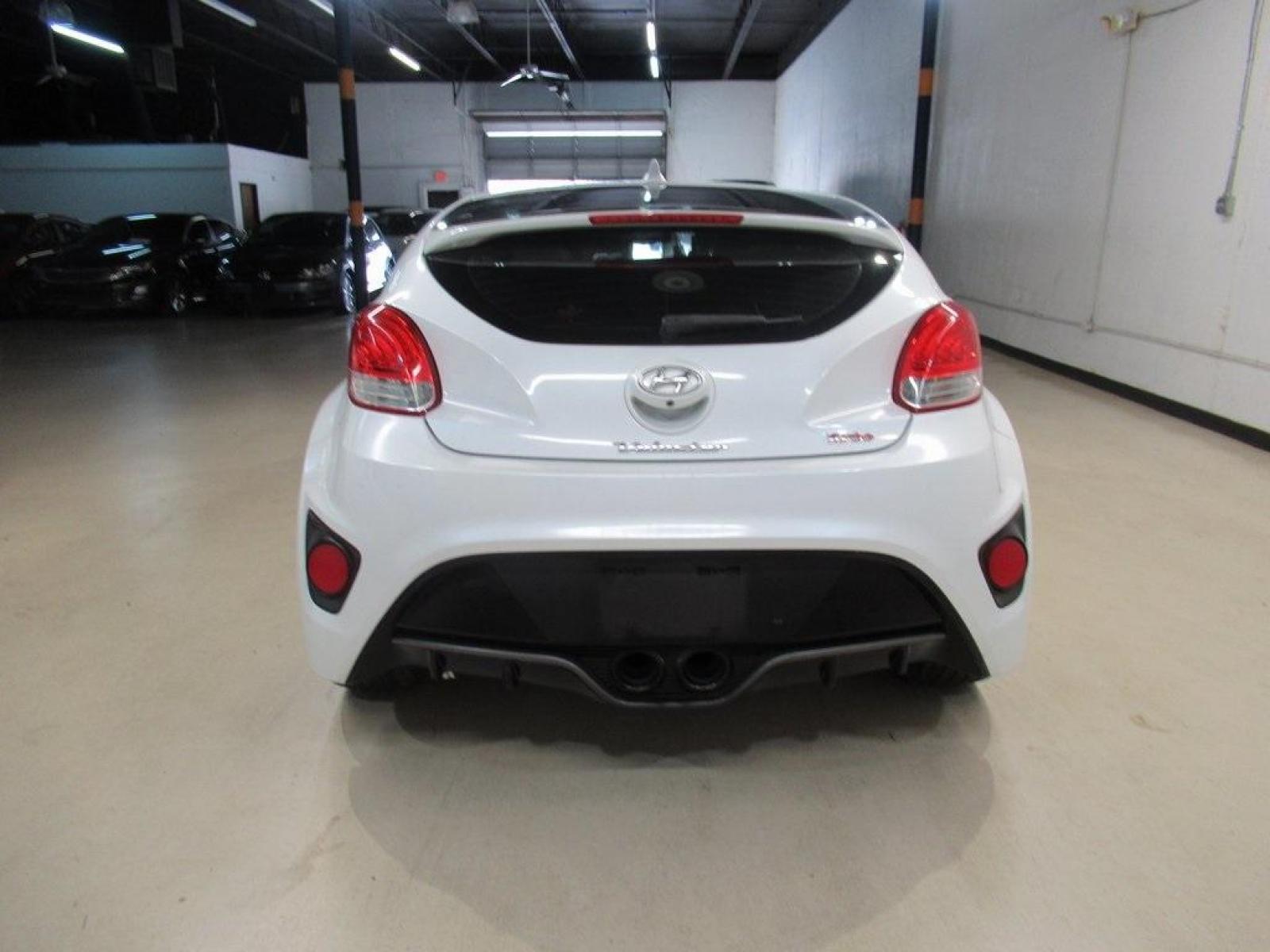 2014 Elite White Pearl /Black Hyundai Veloster Base (KMHTC6AE8EU) with an 1.6L I4 engine, Automatic transmission, located at 15300 Midway Rd., Addison, 75001, (972) 702-0011, 32.958321, -96.838074 - HOME OF THE NO HAGGLE PRICE - WHOLESALE PRICES TO THE PUBLIC!! 3D Hatchback, 1.6L I4, 6-Speed, FWD, White. Odometer is 2034 miles below market average!<br><br>White 2014 Hyundai Veloster<br><br>Recent Arrival!<br><br>Awards:<br> * 2014 KBB.com 10 Coolest New Cars Under $18,000<br><br>At Midway Auto - Photo #7