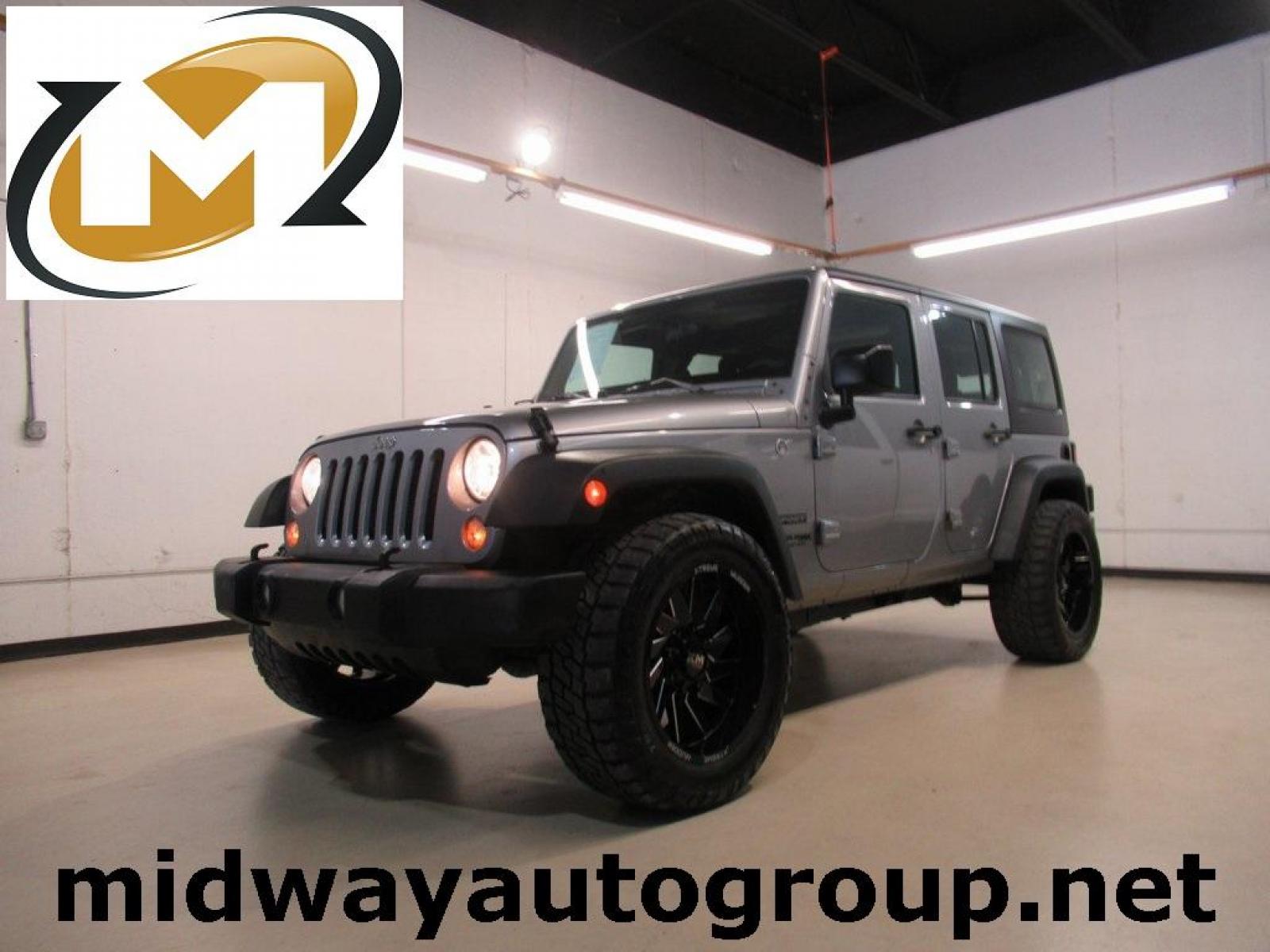 2018 Billet Silver Metallic Clearcoat /Black Jeep Wrangler JK Unlimited Sport (1C4BJWDG6JL) with an 3.6L V6 24V VVT engine, Automatic transmission, located at 15300 Midway Rd., Addison, TX, 75001, (972) 702-0011, 32.958321, -96.838074 - Photo #0