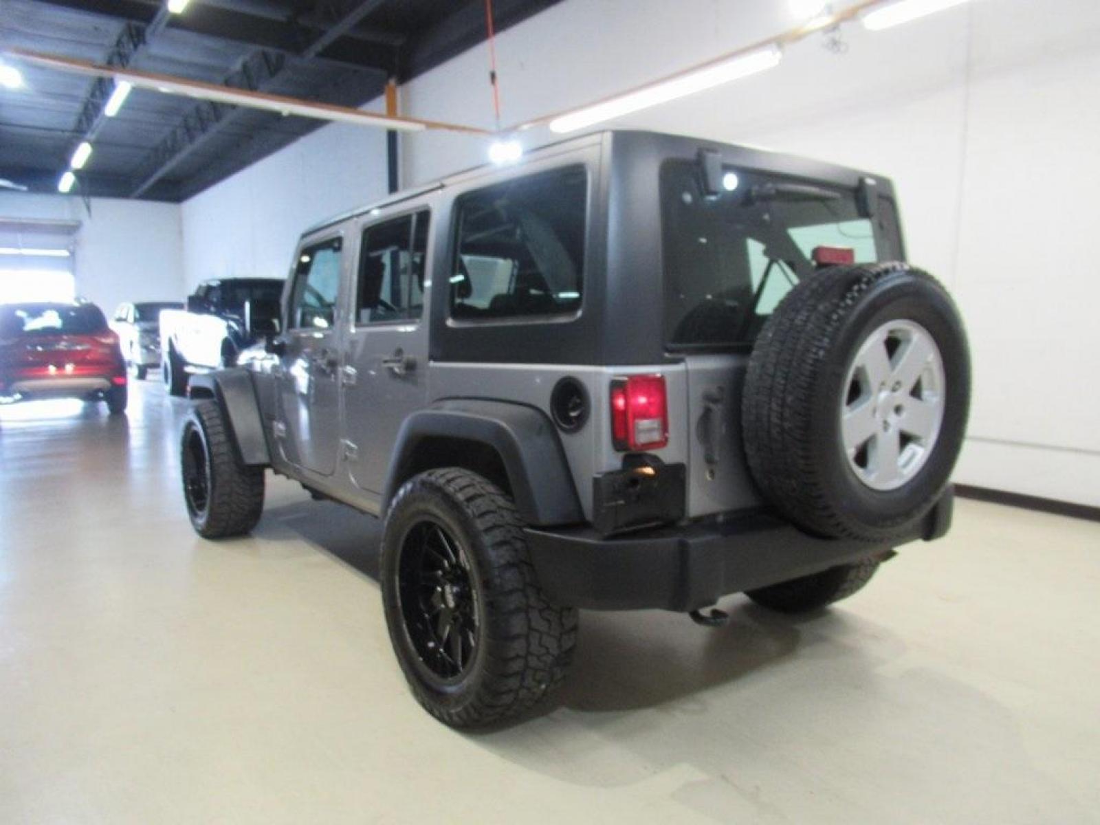 2018 Billet Silver Metallic Clearcoat /Black Jeep Wrangler JK Unlimited Sport (1C4BJWDG6JL) with an 3.6L V6 24V VVT engine, Automatic transmission, located at 15300 Midway Rd., Addison, TX, 75001, (972) 702-0011, 32.958321, -96.838074 - Photo #3