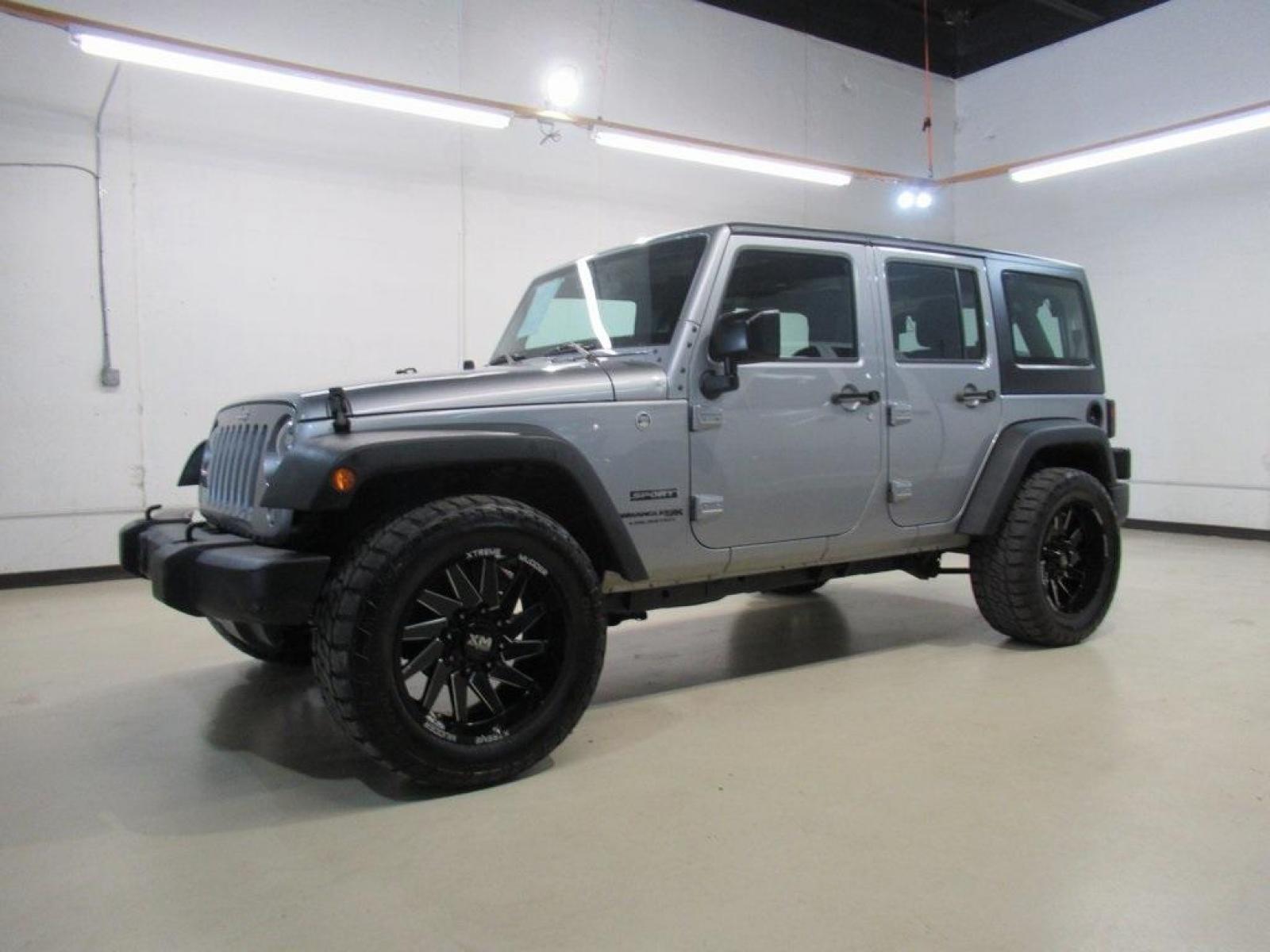 2018 Billet Silver Metallic Clearcoat /Black Jeep Wrangler JK Unlimited Sport (1C4BJWDG6JL) with an 3.6L V6 24V VVT engine, Automatic transmission, located at 15300 Midway Rd., Addison, 75001, (972) 702-0011, 32.958321, -96.838074 - HOME OF THE NO HAGGLE PRICE - WHOLESALE PRICES TO THE PUBLIC!! 4D Sport Utility, 3.6L V6 24V VVT, 4WD, Silver, ABS brakes, Compass, Electronic Stability Control, Low tire pressure warning, Traction control.<br><br>Silver 2018 Jeep Wrangler JK Unlimited Sport<br><br>Recent Arrival!<br><br>Awards:<br> - Photo #4