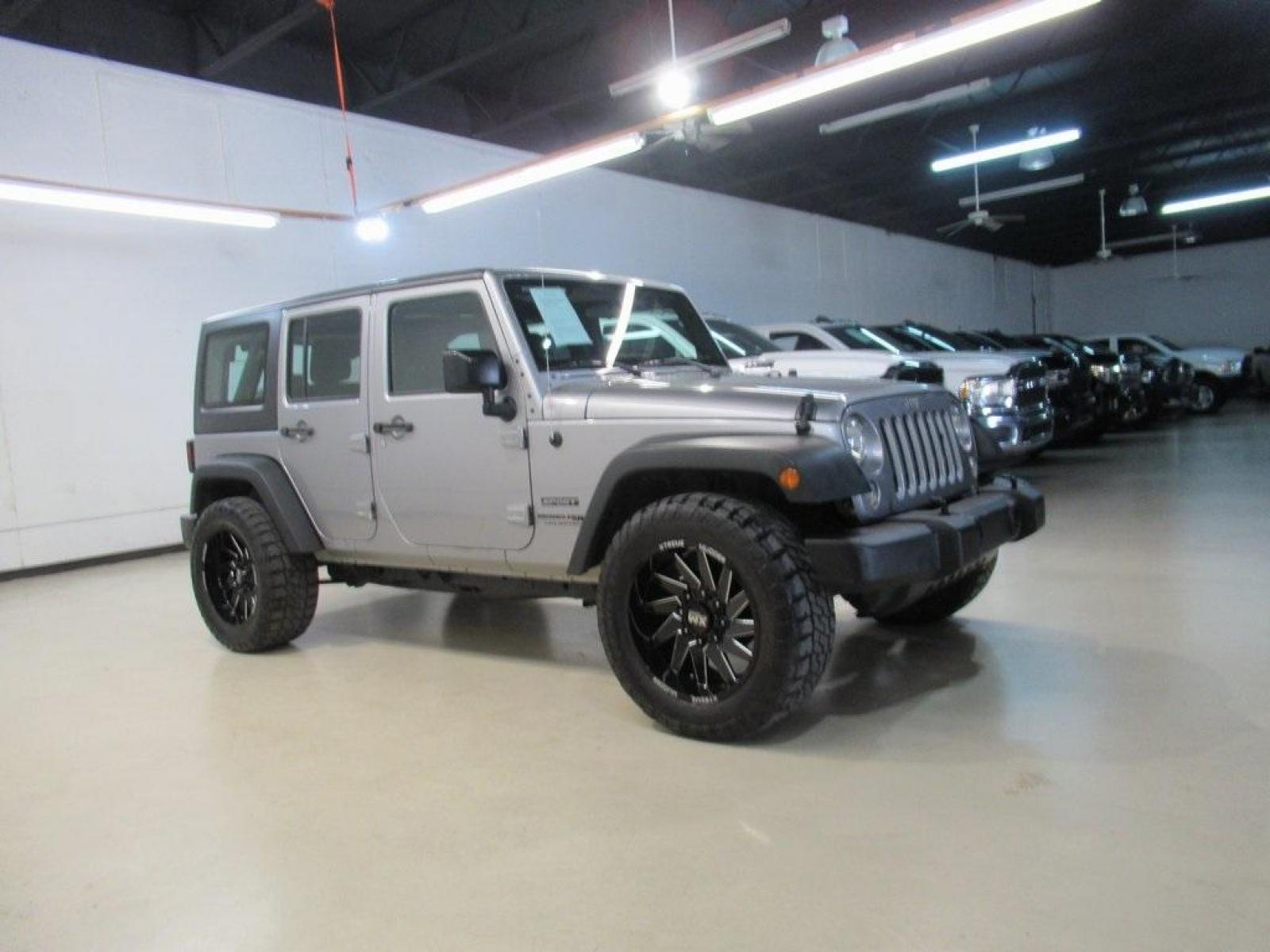 2018 Billet Silver Metallic Clearcoat /Black Jeep Wrangler JK Unlimited Sport (1C4BJWDG6JL) with an 3.6L V6 24V VVT engine, Automatic transmission, located at 15300 Midway Rd., Addison, 75001, (972) 702-0011, 32.958321, -96.838074 - HOME OF THE NO HAGGLE PRICE - WHOLESALE PRICES TO THE PUBLIC!! 4D Sport Utility, 3.6L V6 24V VVT, 4WD, Silver, ABS brakes, Compass, Electronic Stability Control, Low tire pressure warning, Traction control.<br><br>Silver 2018 Jeep Wrangler JK Unlimited Sport<br><br>Recent Arrival!<br><br>Awards:<br> - Photo #6