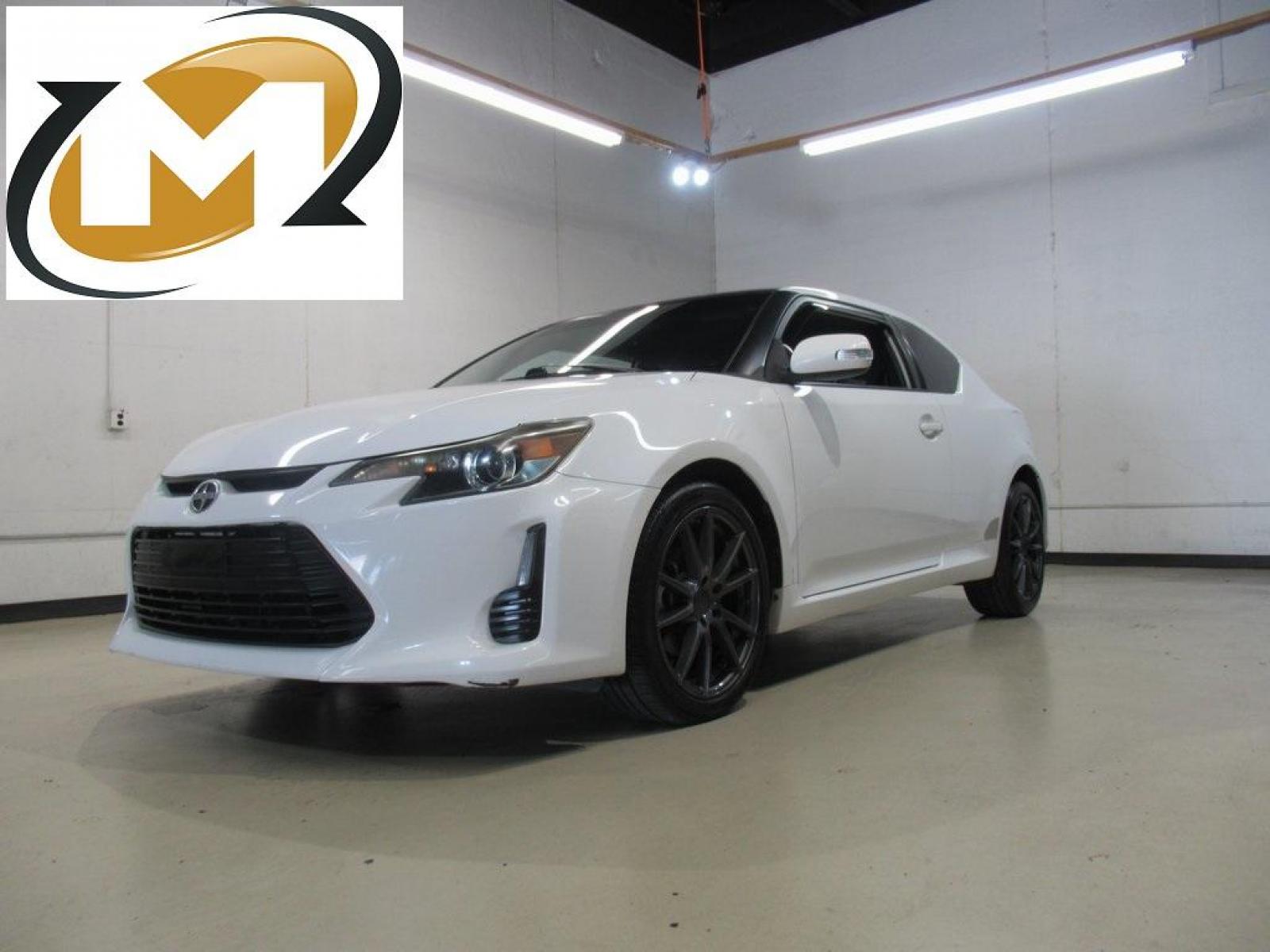 2014 Super White /Dark Charcoal Scion tC Base (JTKJF5C73E3) with an 2.5L I4 Dual VVT-i engine, Automatic transmission, located at 15300 Midway Rd., Addison, 75001, (972) 702-0011, 32.958321, -96.838074 - HOME OF THE NO HAGGLE PRICE - WHOLESALE PRICES TO THE PUBLIC!! 2D Coupe, 2.5L I4 Dual VVT-i, 6-Speed Automatic, FWD, Super White.<br><br>Super White 2014 Scion tC<br><br>23/31 City/Highway MPG<br><br>Awards:<br> * 2014 IIHS Top Safety Pick, Top Safety Pick, Top Safety Pick+<br><br>At Midway Auto Gr - Photo #0