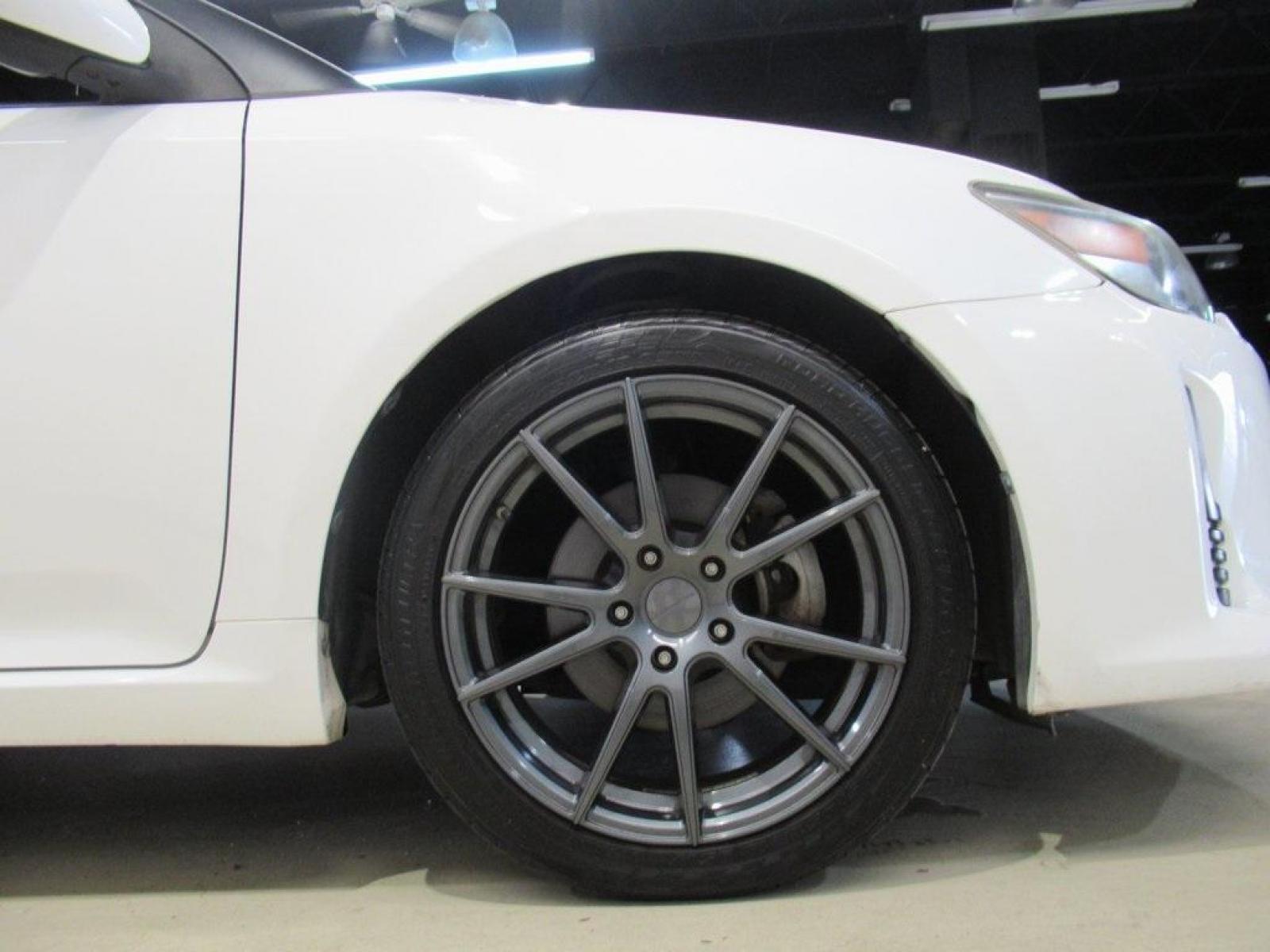 2014 Super White /Dark Charcoal Scion tC Base (JTKJF5C73E3) with an 2.5L I4 Dual VVT-i engine, Automatic transmission, located at 15300 Midway Rd., Addison, 75001, (972) 702-0011, 32.958321, -96.838074 - HOME OF THE NO HAGGLE PRICE - WHOLESALE PRICES TO THE PUBLIC!! 2D Coupe, 2.5L I4 Dual VVT-i, 6-Speed Automatic, FWD, Super White.<br><br>Super White 2014 Scion tC<br><br>23/31 City/Highway MPG<br><br>Awards:<br> * 2014 IIHS Top Safety Pick, Top Safety Pick, Top Safety Pick+<br><br>At Midway Auto Gr - Photo #8