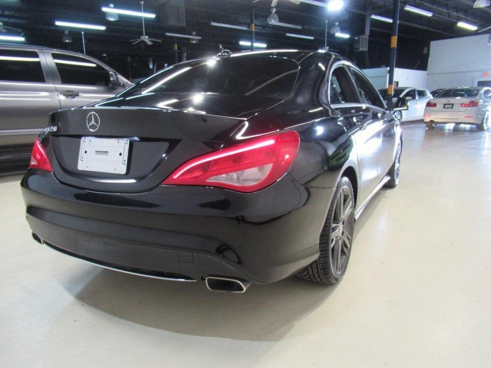 2015 Black /Black Mercedes-Benz CLA CLA 250 (WDDSJ4EB5FN) with an 2.0L I4 Turbocharged engine, Automatic transmission, located at 15300 Midway Rd., Addison, 75001, (972) 702-0011, 32.958321, -96.838074 - HOME OF THE NO HAGGLE PRICE - WHOLESALE PRICES TO THE PUBLIC!! CLA 250, 4D Sedan, 2.0L I4 Turbocharged, 7-Speed Double-clutch, FWD, Black, Black w/MB-Tex Upholstery, Panorama Sunroof.<br><br>Black 2015 Mercedes-Benz CLA CLA 250<br><br>26/38 City/Highway MPG<br><br><br>At Midway Auto Group, we strive - Photo #2