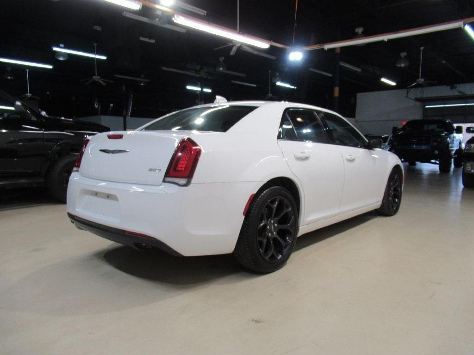 2019 Bright White Clearcoat /Black Chrysler 300 Touring (2C3CCAAG4KH) with an 3.6L V6 24V VVT engine, Automatic transmission, located at 15300 Midway Rd., Addison, 75001, (972) 702-0011, 32.958321, -96.838074 - Photo #2