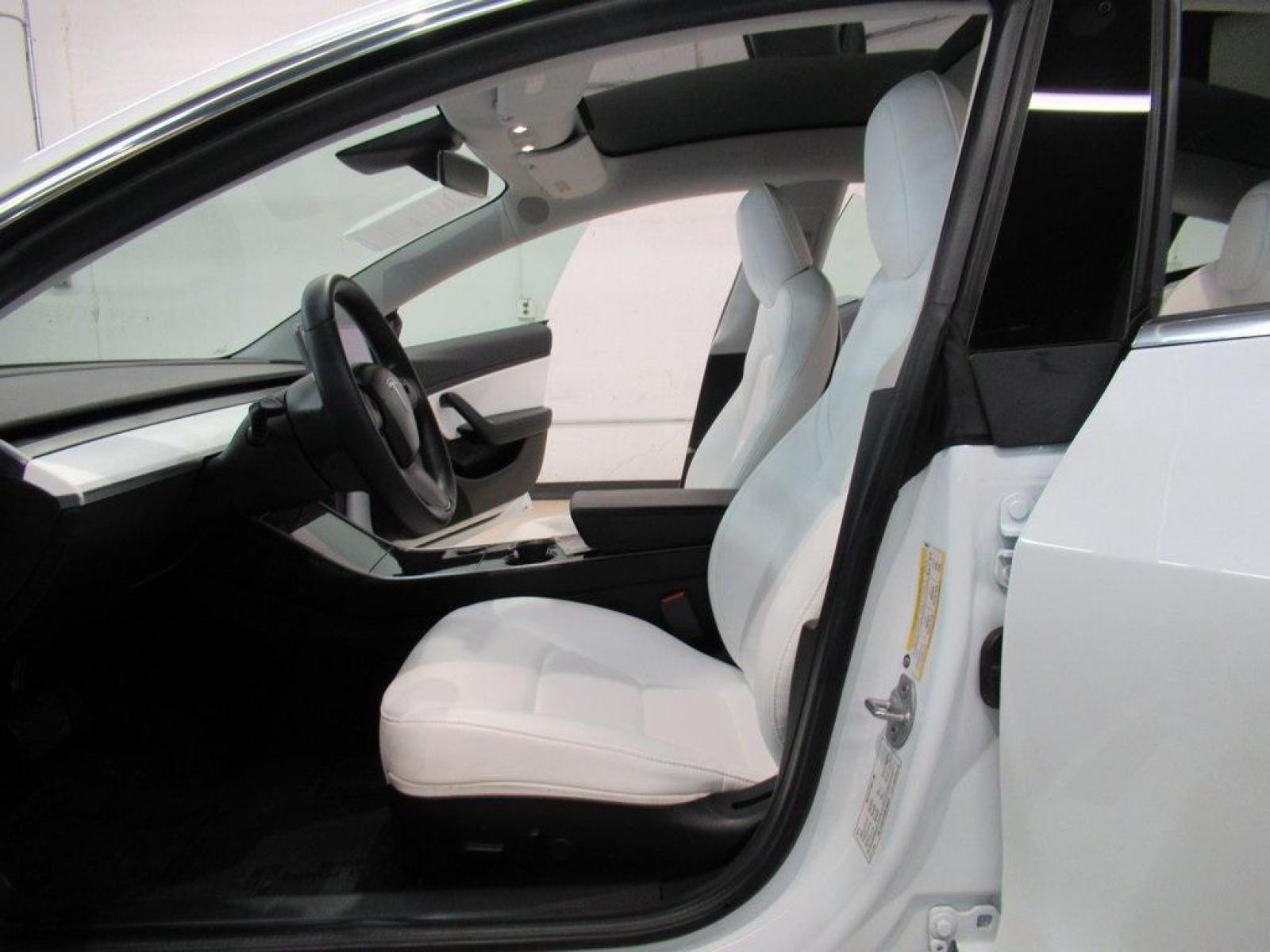 2019 Pearl White Multi-Coat /White/Black Tesla Model 3 Mid Range (5YJ3E1EA3KF) with an 10-Cylinder Electric ZEV engine, Automatic transmission, located at 15300 Midway Rd., Addison, 75001, (972) 702-0011, 32.958321, -96.838074 - HOME OF THE NO HAGGLE PRICE - WHOLESALE PRICES TO THE PUBLIC!! Model 3 Mid Range, 4D Sedan, 10-Cylinder Electric ZEV, 1-Speed Automatic, RWD, White, White/Black w/Premium Seat Trim. Priced below KBB Fair Purchase Price! Odometer is 6764 miles below market average!<br><br>White 2019 Tesla Model 3 Mid - Photo #15