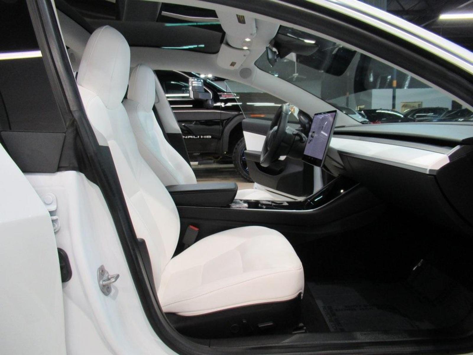 2019 Pearl White Multi-Coat /White/Black Tesla Model 3 Mid Range (5YJ3E1EA3KF) with an 10-Cylinder Electric ZEV engine, Automatic transmission, located at 15300 Midway Rd., Addison, 75001, (972) 702-0011, 32.958321, -96.838074 - HOME OF THE NO HAGGLE PRICE - WHOLESALE PRICES TO THE PUBLIC!! Model 3 Mid Range, 4D Sedan, 10-Cylinder Electric ZEV, 1-Speed Automatic, RWD, White, White/Black w/Premium Seat Trim. Priced below KBB Fair Purchase Price! Odometer is 6764 miles below market average!<br><br>White 2019 Tesla Model 3 Mid - Photo #17