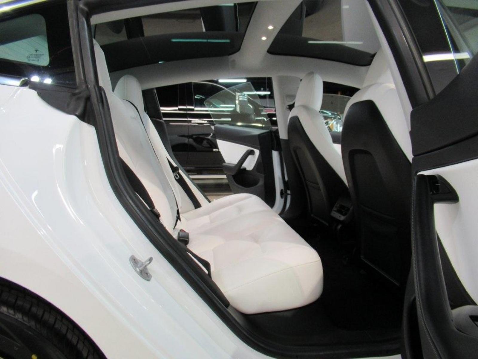 2019 Pearl White Multi-Coat /White/Black Tesla Model 3 Mid Range (5YJ3E1EA3KF) with an 10-Cylinder Electric ZEV engine, Automatic transmission, located at 15300 Midway Rd., Addison, 75001, (972) 702-0011, 32.958321, -96.838074 - HOME OF THE NO HAGGLE PRICE - WHOLESALE PRICES TO THE PUBLIC!! Model 3 Mid Range, 4D Sedan, 10-Cylinder Electric ZEV, 1-Speed Automatic, RWD, White, White/Black w/Premium Seat Trim. Priced below KBB Fair Purchase Price! Odometer is 6764 miles below market average!<br><br>White 2019 Tesla Model 3 Mid - Photo #18
