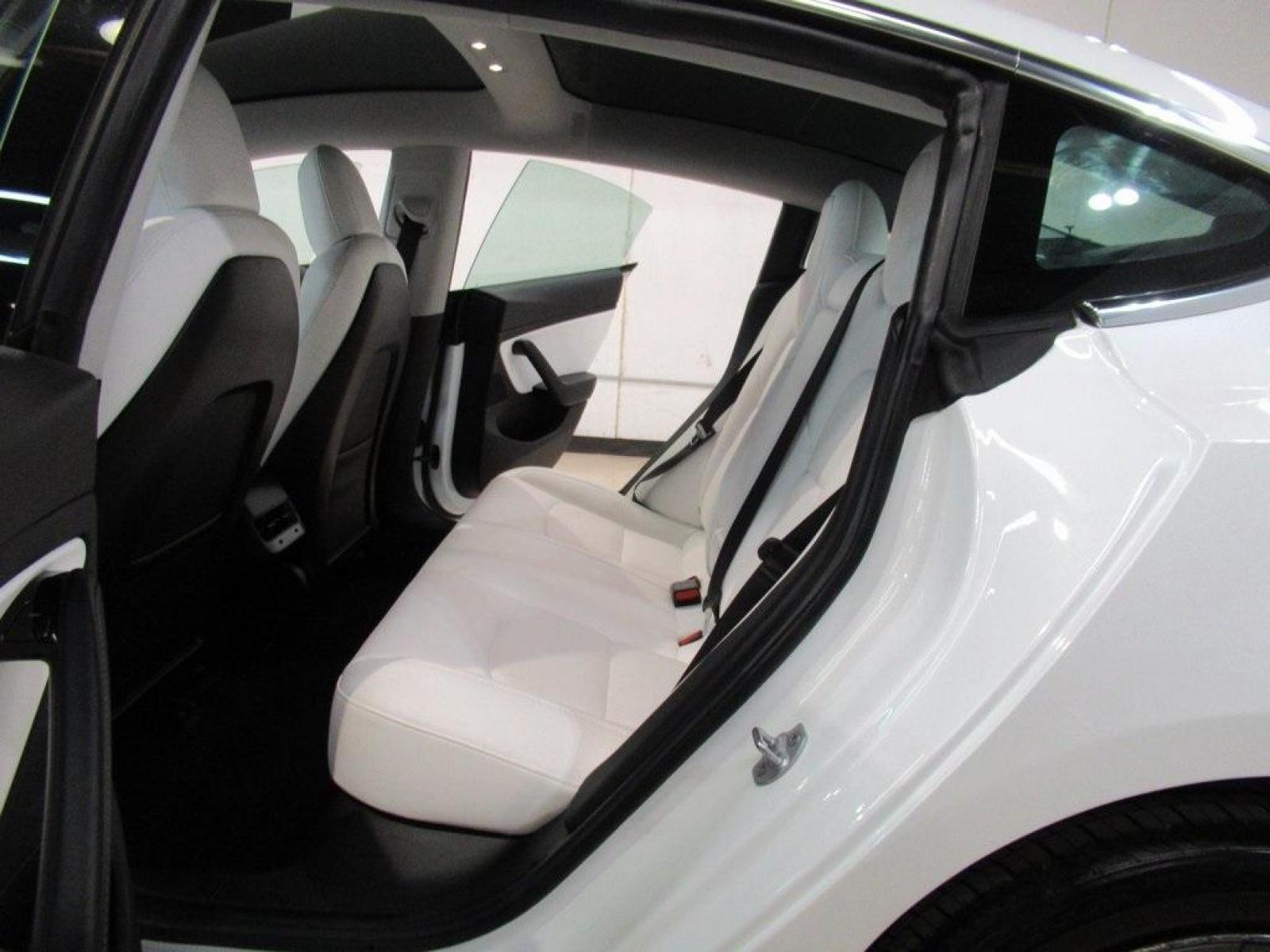 2019 Pearl White Multi-Coat /White/Black Tesla Model 3 Mid Range (5YJ3E1EA3KF) with an 10-Cylinder Electric ZEV engine, Automatic transmission, located at 15300 Midway Rd., Addison, 75001, (972) 702-0011, 32.958321, -96.838074 - HOME OF THE NO HAGGLE PRICE - WHOLESALE PRICES TO THE PUBLIC!! Model 3 Mid Range, 4D Sedan, 10-Cylinder Electric ZEV, 1-Speed Automatic, RWD, White, White/Black w/Premium Seat Trim. Priced below KBB Fair Purchase Price! Odometer is 6764 miles below market average!<br><br>White 2019 Tesla Model 3 Mid - Photo #19