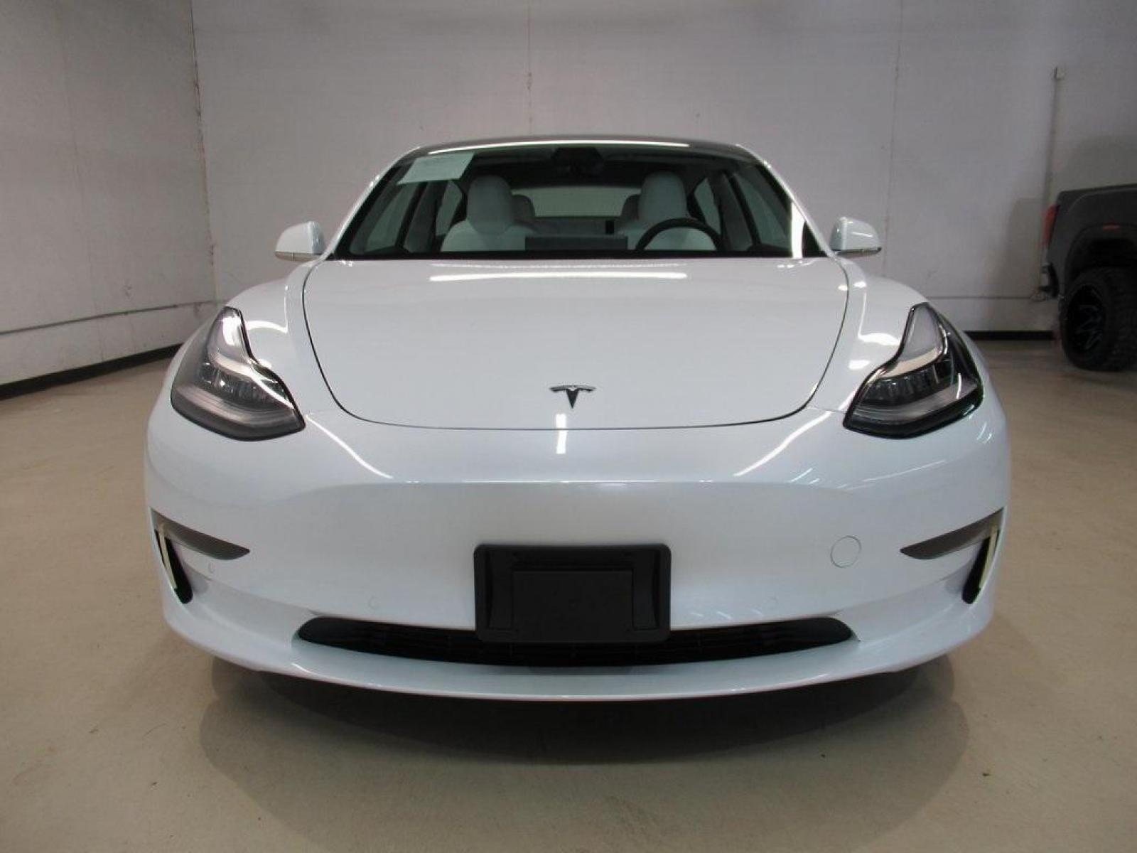 2019 Pearl White Multi-Coat /White/Black Tesla Model 3 Mid Range (5YJ3E1EA3KF) with an 10-Cylinder Electric ZEV engine, Automatic transmission, located at 15300 Midway Rd., Addison, 75001, (972) 702-0011, 32.958321, -96.838074 - HOME OF THE NO HAGGLE PRICE - WHOLESALE PRICES TO THE PUBLIC!! Model 3 Mid Range, 4D Sedan, 10-Cylinder Electric ZEV, 1-Speed Automatic, RWD, White, White/Black w/Premium Seat Trim. Priced below KBB Fair Purchase Price! Odometer is 6764 miles below market average!<br><br>White 2019 Tesla Model 3 Mid - Photo #5