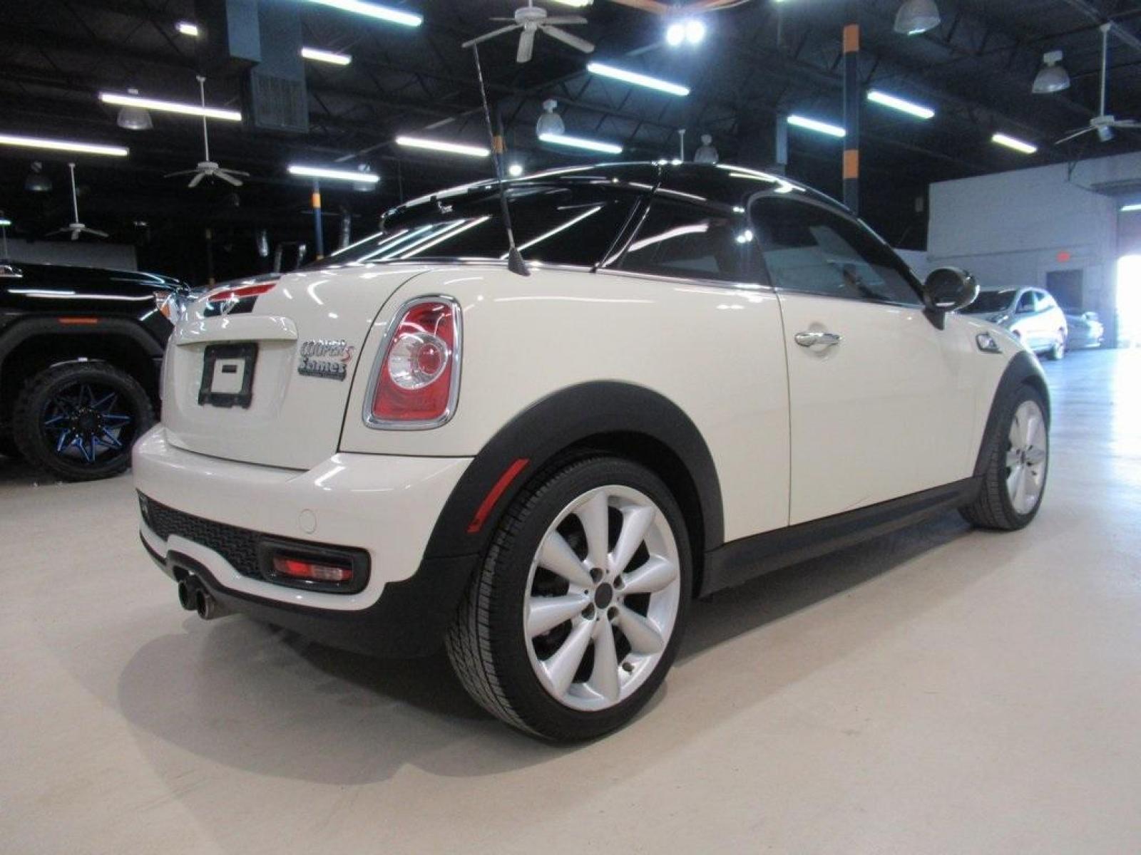 2015 Pepper White /Carbon Black MINI Cooper S Base (WMWSX3C52FT) with an 1.6L I4 DOHC 16V Turbocharged engine, Automatic transmission, located at 15300 Midway Rd., Addison, 75001, (972) 702-0011, 32.958321, -96.838074 - HOME OF THE NO HAGGLE PRICE - WHOLESALE PRICES TO THE PUBLIC!! 2D Coupe, 1.6L I4 DOHC 16V Turbocharged, 6-Speed Automatic Steptronic, FWD, Pepper White, Carbon Black Artificial Leather.<br><br>Pepper White 2015 MINI Cooper S<br><br>25/34 City/Highway MPG<br><br><br>At Midway Auto Group, we strive to - Photo #2