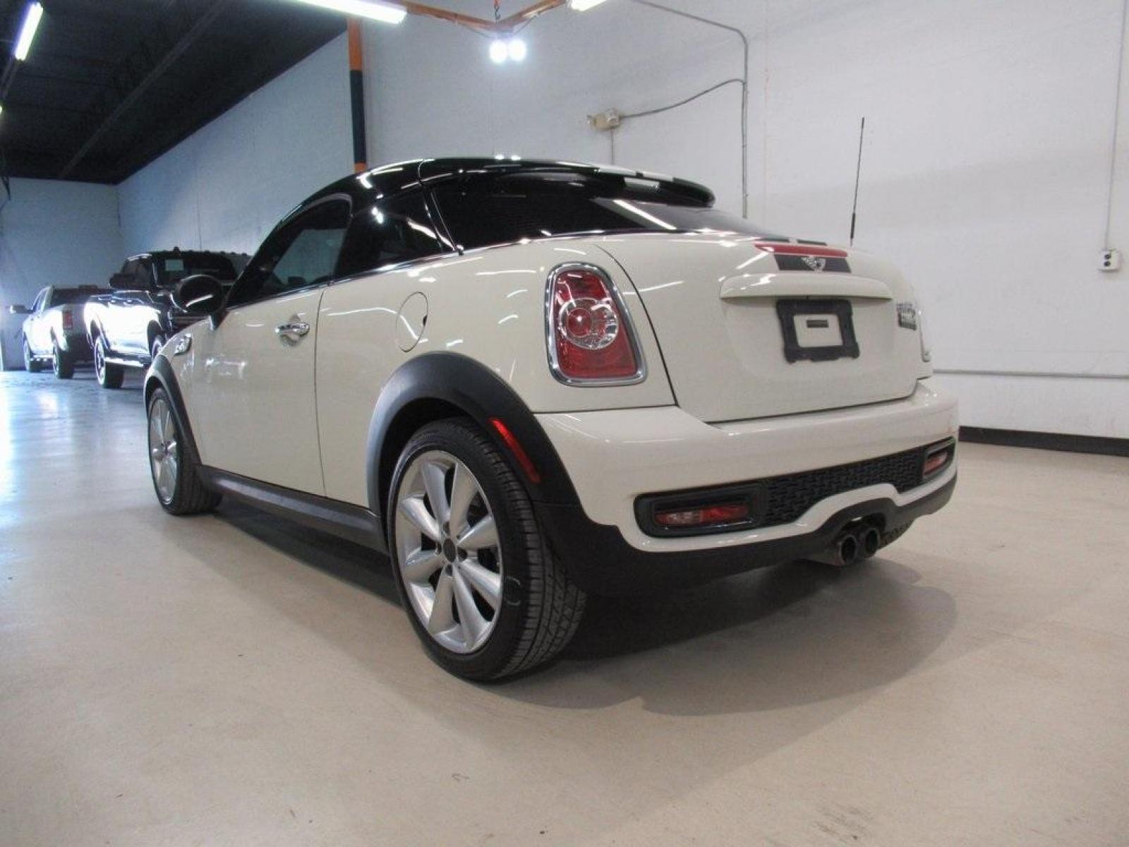 2015 Pepper White /Carbon Black MINI Cooper S Base (WMWSX3C52FT) with an 1.6L I4 DOHC 16V Turbocharged engine, Automatic transmission, located at 15300 Midway Rd., Addison, 75001, (972) 702-0011, 32.958321, -96.838074 - HOME OF THE NO HAGGLE PRICE - WHOLESALE PRICES TO THE PUBLIC!! 2D Coupe, 1.6L I4 DOHC 16V Turbocharged, 6-Speed Automatic Steptronic, FWD, Pepper White, Carbon Black Artificial Leather.<br><br>Pepper White 2015 MINI Cooper S<br><br>25/34 City/Highway MPG<br><br><br>At Midway Auto Group, we strive to - Photo #3