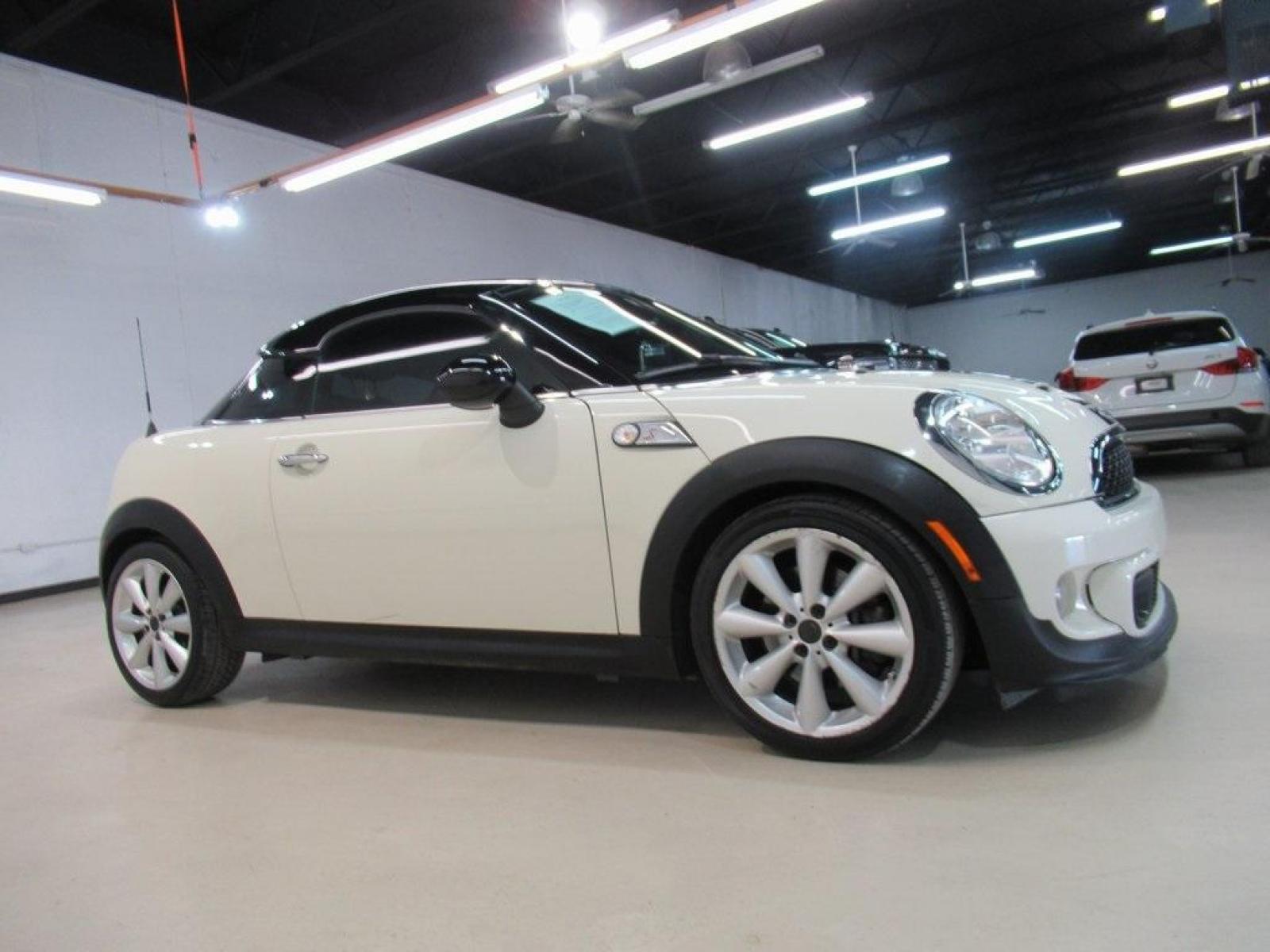 2015 Pepper White /Carbon Black MINI Cooper S Base (WMWSX3C52FT) with an 1.6L I4 DOHC 16V Turbocharged engine, Automatic transmission, located at 15300 Midway Rd., Addison, 75001, (972) 702-0011, 32.958321, -96.838074 - HOME OF THE NO HAGGLE PRICE - WHOLESALE PRICES TO THE PUBLIC!! 2D Coupe, 1.6L I4 DOHC 16V Turbocharged, 6-Speed Automatic Steptronic, FWD, Pepper White, Carbon Black Artificial Leather.<br><br>Pepper White 2015 MINI Cooper S<br><br>25/34 City/Highway MPG<br><br><br>At Midway Auto Group, we strive to - Photo #6